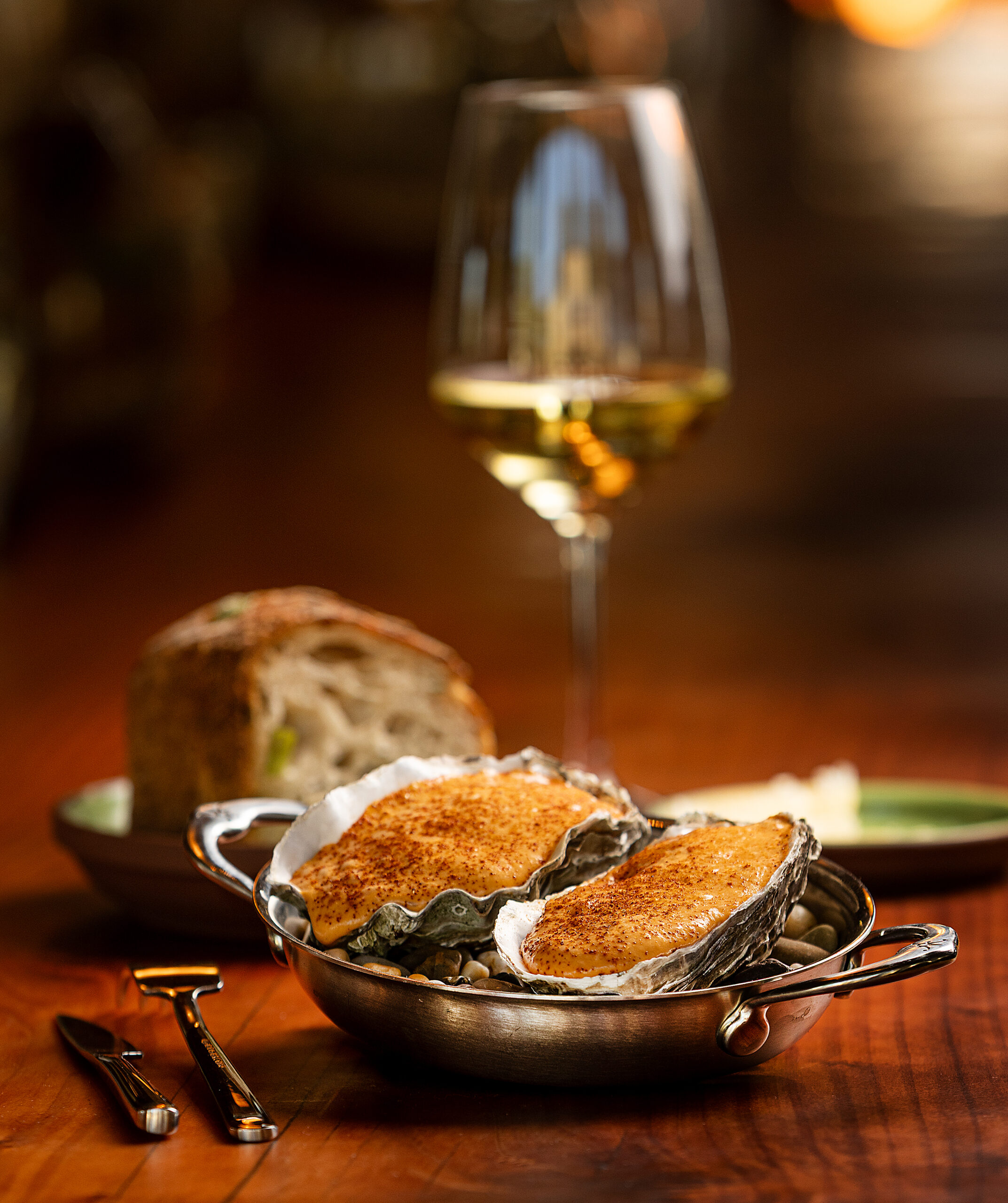 Grilled Hog Island Oysters with smoked choron sauce from Folia Friday, September 19, 2025 in Healdsburg. (John Burgess / The Press Democrat)