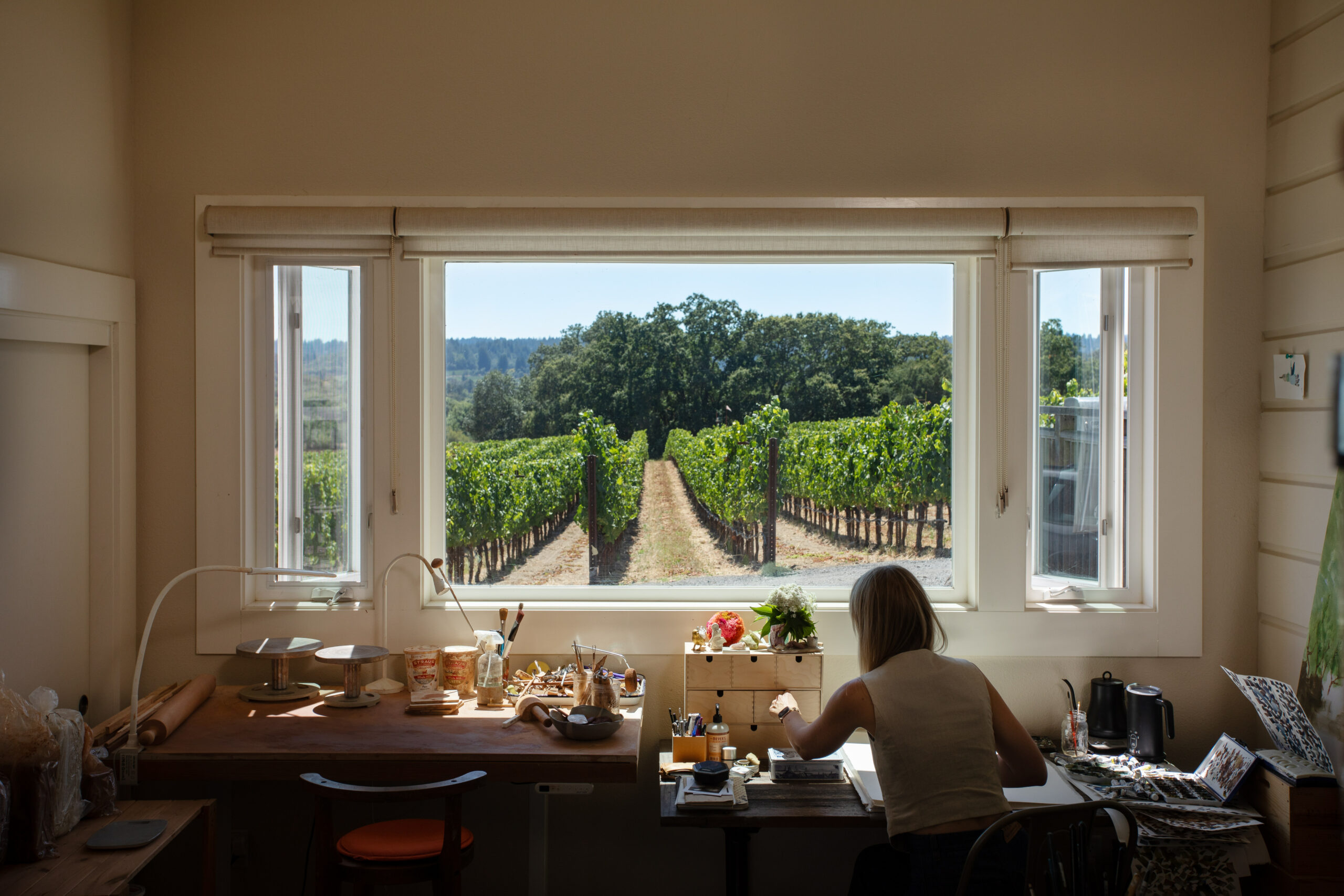 Artist Cristina Hobbs can watch nature unfold among the vineyards while working in her studio in an old farmhouse at Paul Hobbs's Ross Station Estate. (Eileen Roche / for Sonoma Magazine)