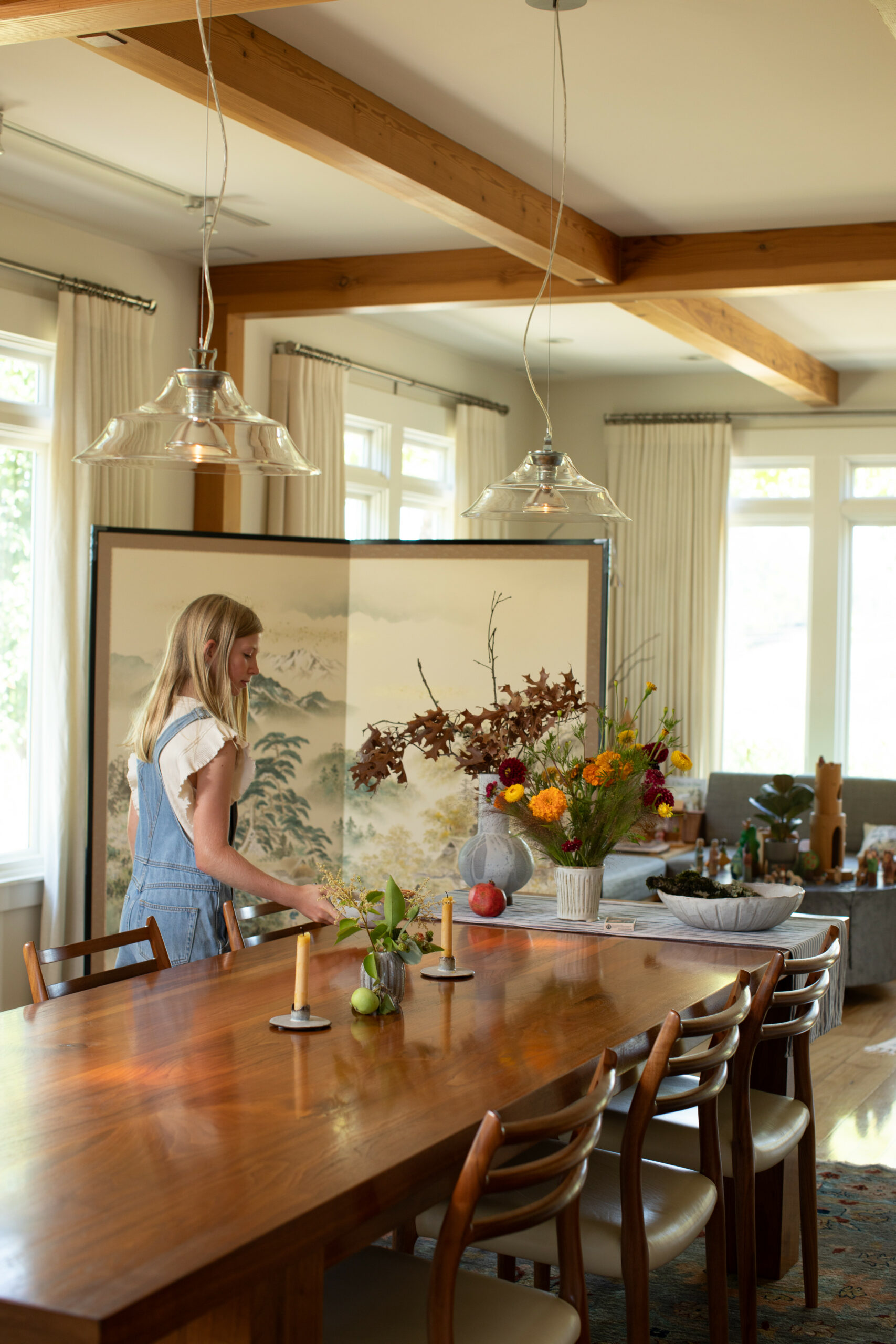 A custom-made walnut dining table is the centerpiece of the open-plan dining and living space. Even during the busy harvest season, the Hobbs family makes a point to sit down to dinner together at the table each night. (Eileen Roche / for Sonoma Magazine)