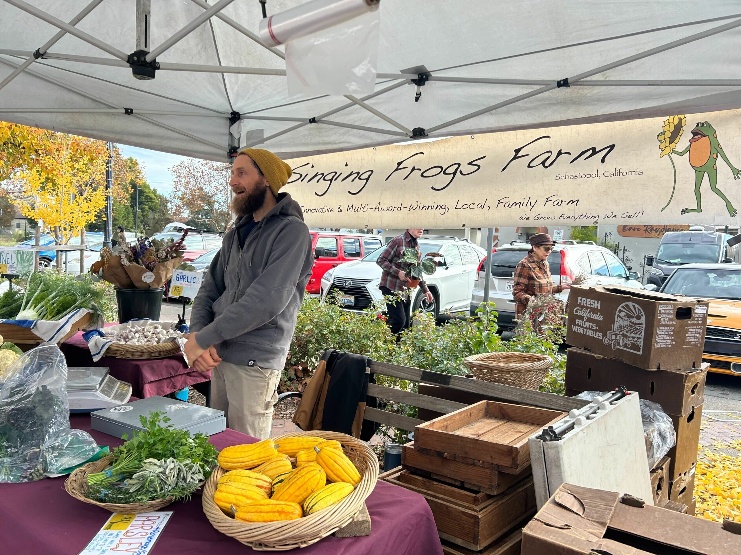 Bobby Murphy of Singing Frogs Farm mans the farm's booth Sunday, Dec. 1, 2024, at the Sebastopol Farmers Market. (Madison Smalstig)