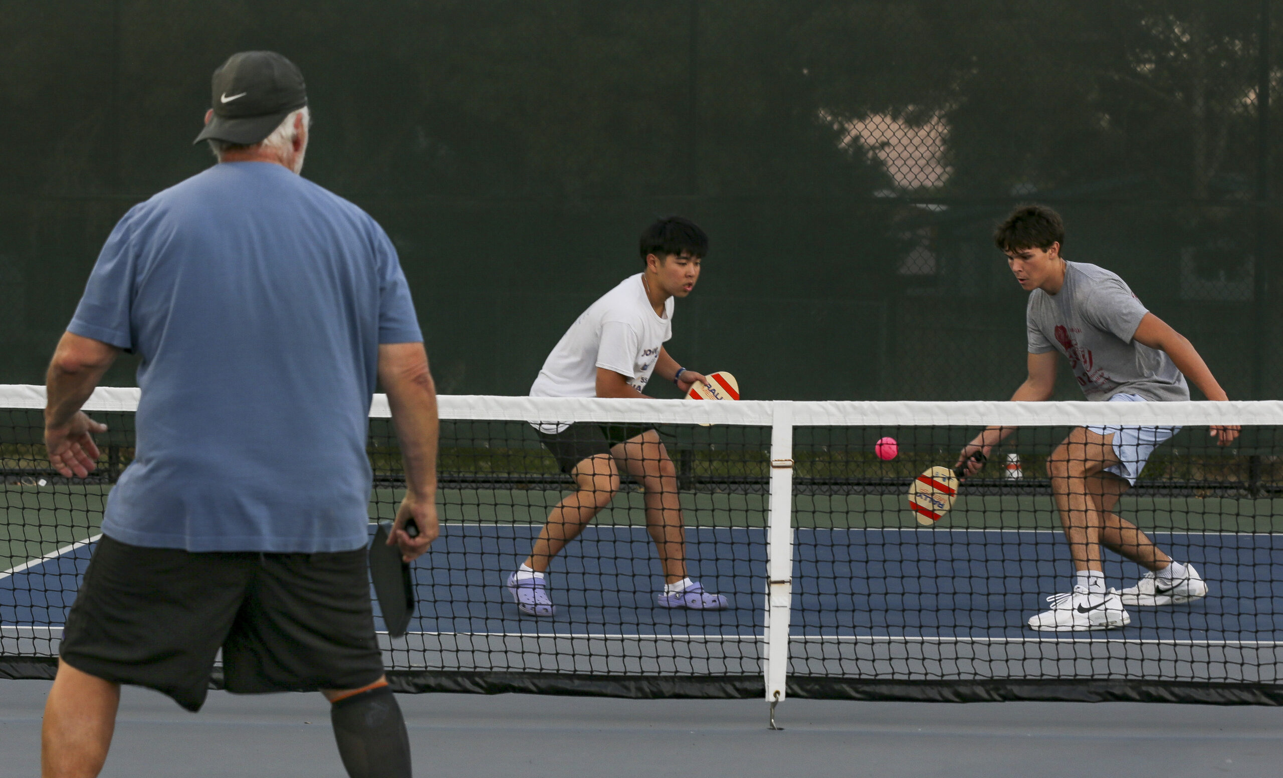 Philip Liu and Elliott Blue, both 17-year-old high school students in Petaluma, play a pickleball match at Lucchesi Park on Thursday, August 24, 2023. (Crissy Pascual / Petaluma Argus-Courier)