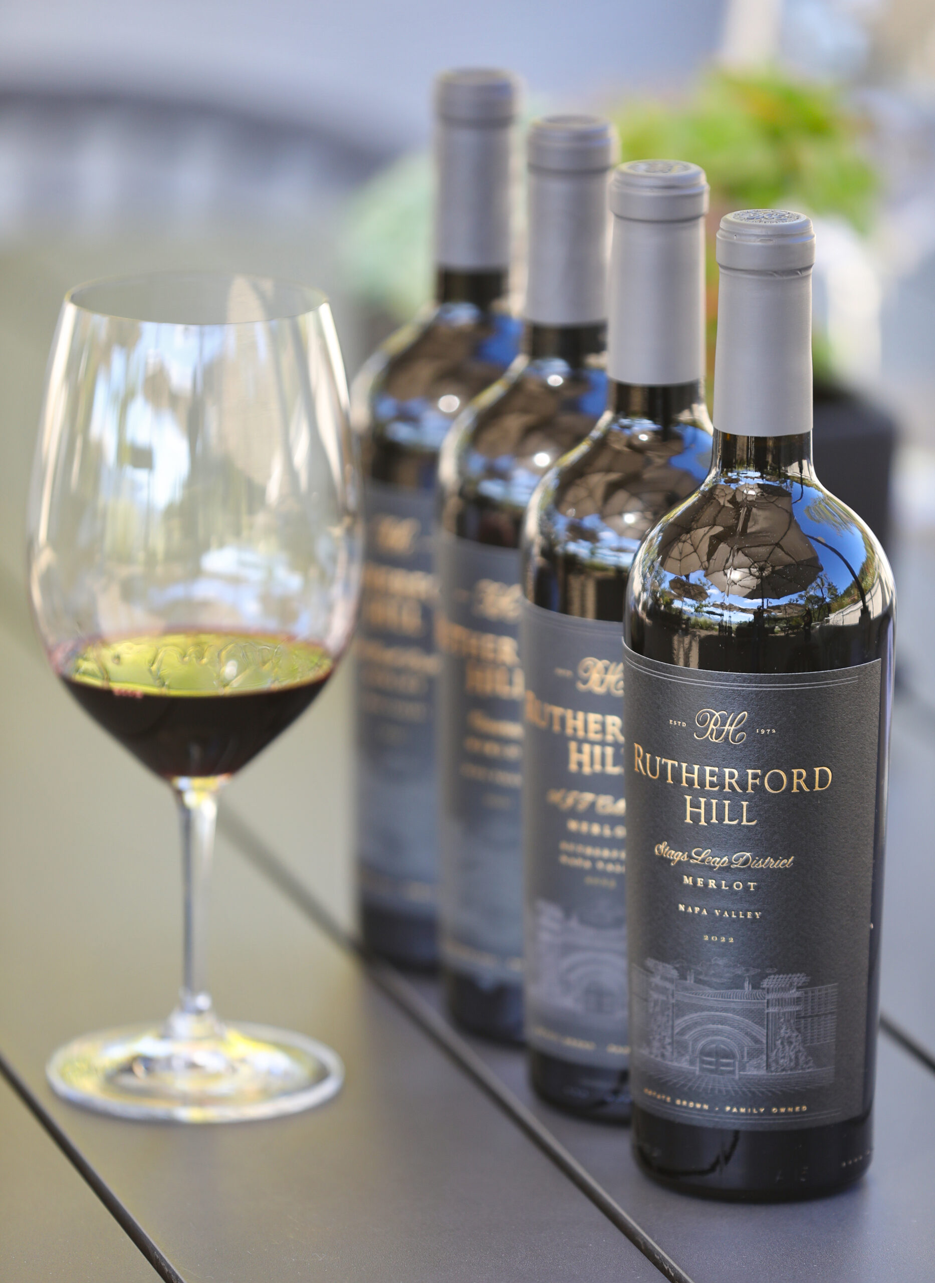 Bottles of Merlot wines at Rutherford Hill Winery in Rutherford on Friday, October 17, 2025. (Christopher Chung/The Press Democrat)