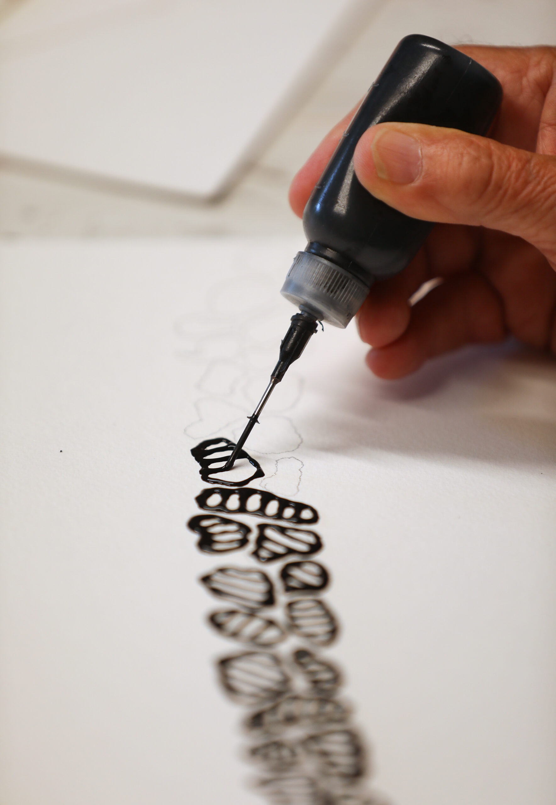 Artist Rick Oginz works on a painting in his home studio in Sonoma on Friday, July 18, 2025. (Christopher Chung/The Press Democrat)
