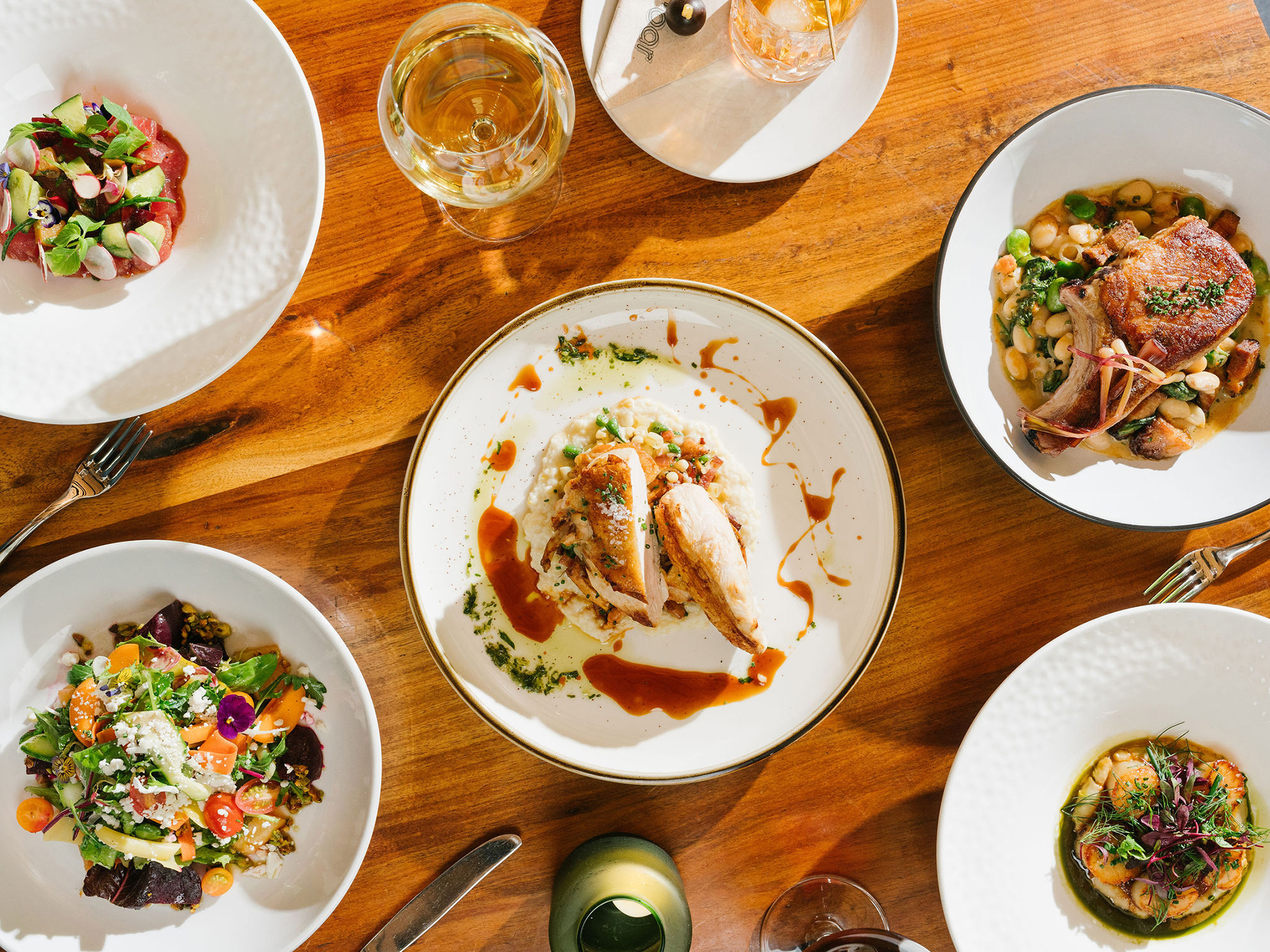 A selection of dishes at Spoonbar in Healdsburg, including the roasted Rocky chicken with chanterelles. (Mike Battey)