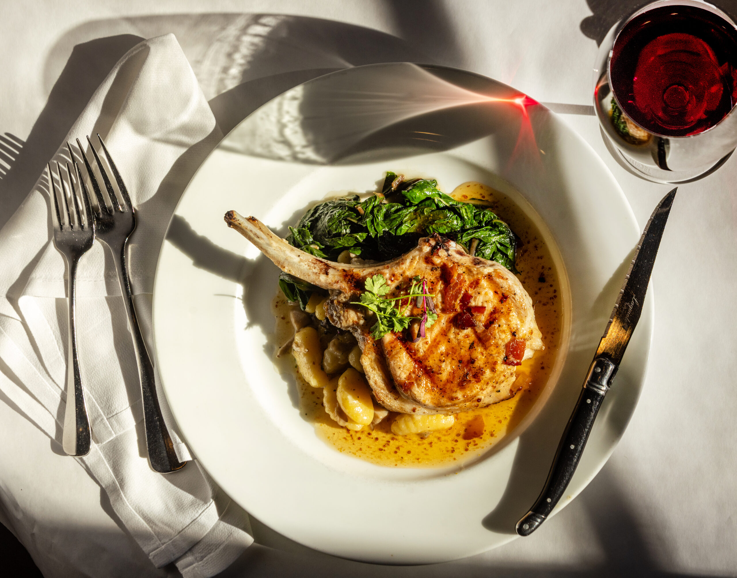 Pork chop with warm mustard seed vinaigrette, roasted mushrooms, potato gnocchi and Swiss chard at Cafe La Haye Wednesday, Oct. 29, 2025, in Sonoma. (John Burgess / The Press Democrat)