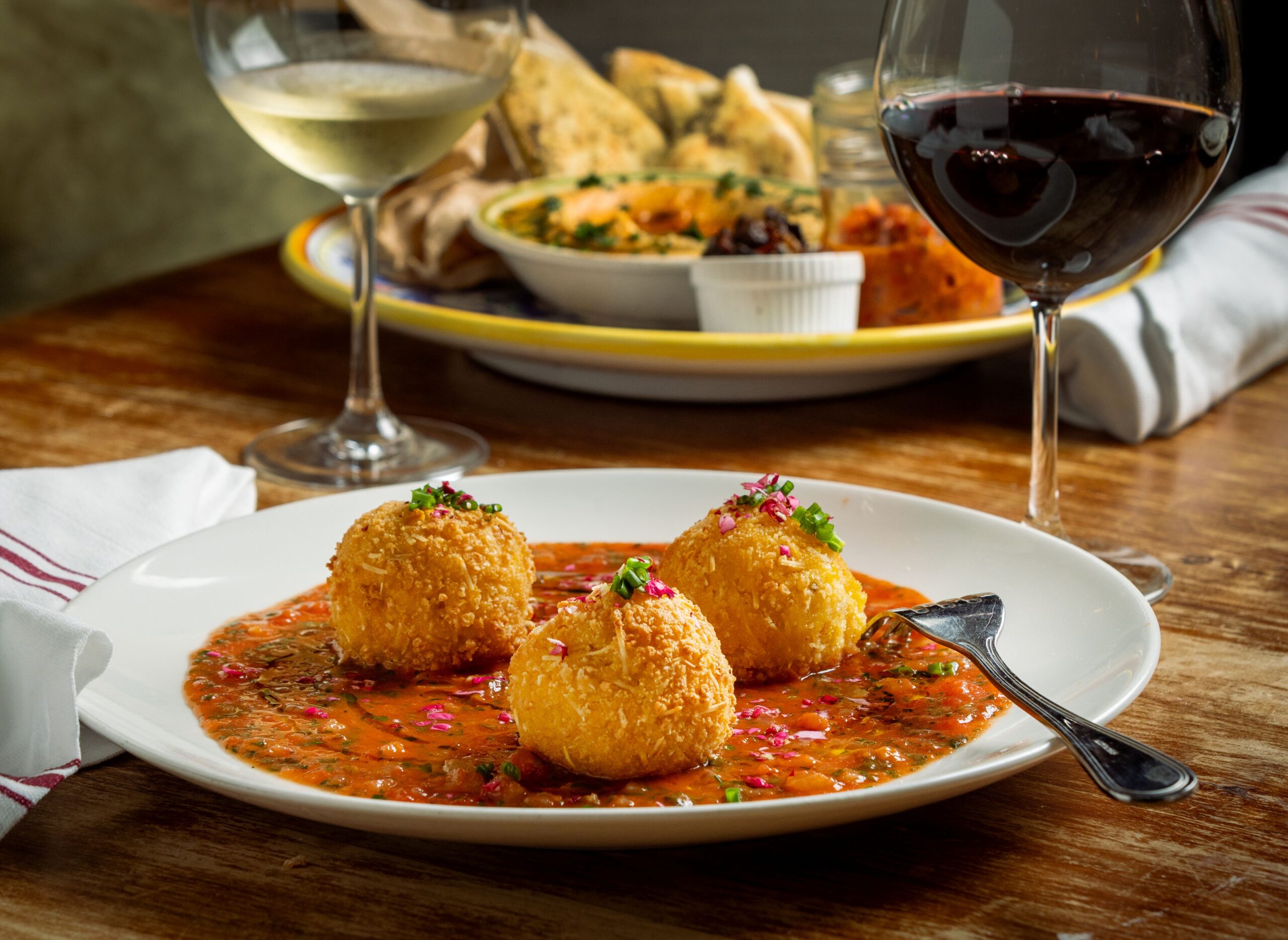 Saffron & Rose Petal Arancini with rice, mozzarella, butter, marinara, shallots, garlic, chives and panko at the Sonoma Wine Shop/La Bodega Kitchen Thursday, Nov. 13, 2025 in Sebastopol. (John Burgess / The Press Democrat)