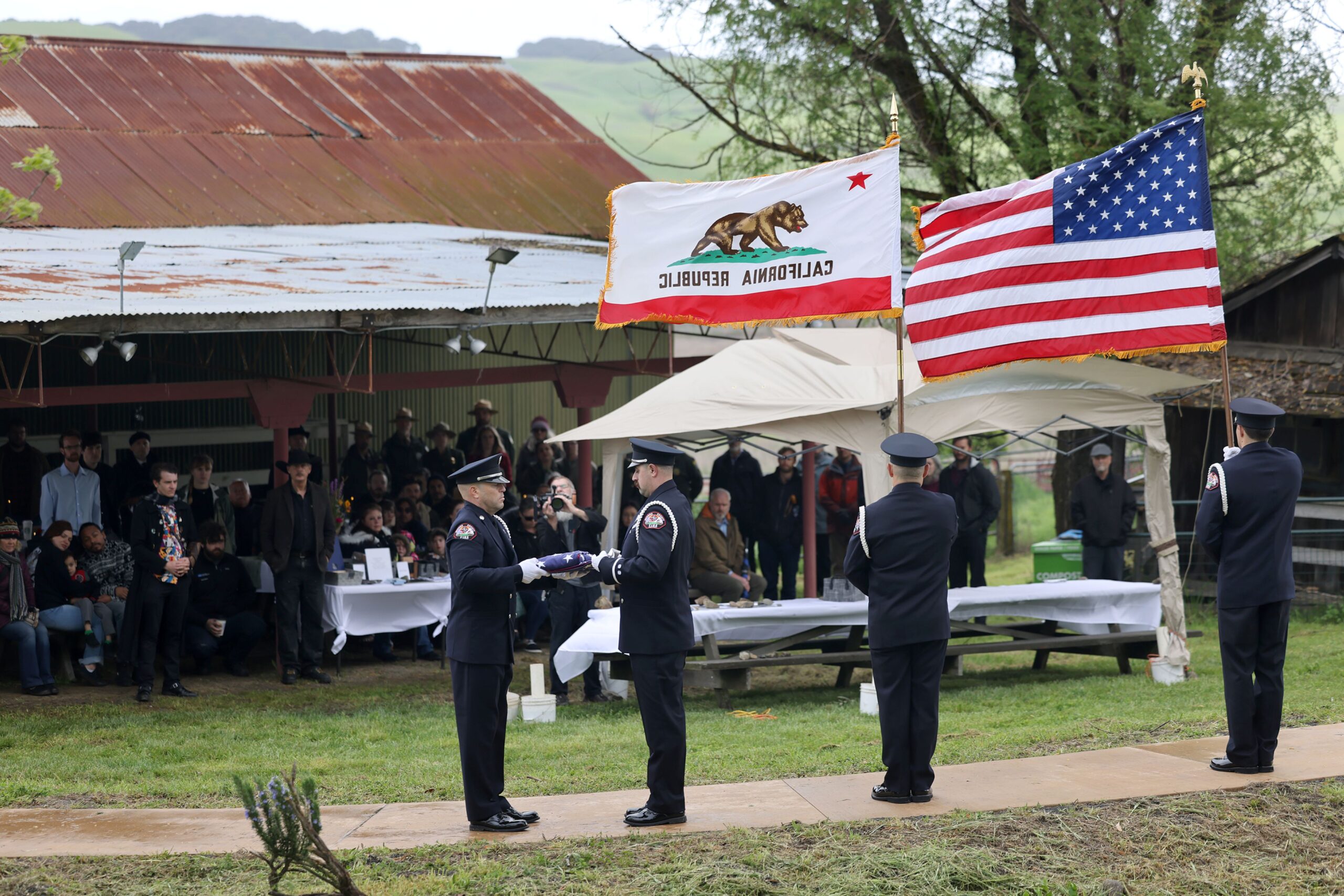 The Sonoma County Fire District honor guard folds an American flag during a celebration of life event remembering Katranne Pringle at Tolay Lake Regional Park in Petaluma Sunday, March 30, 2025. (Beth Schlanker / The Press Democrat)