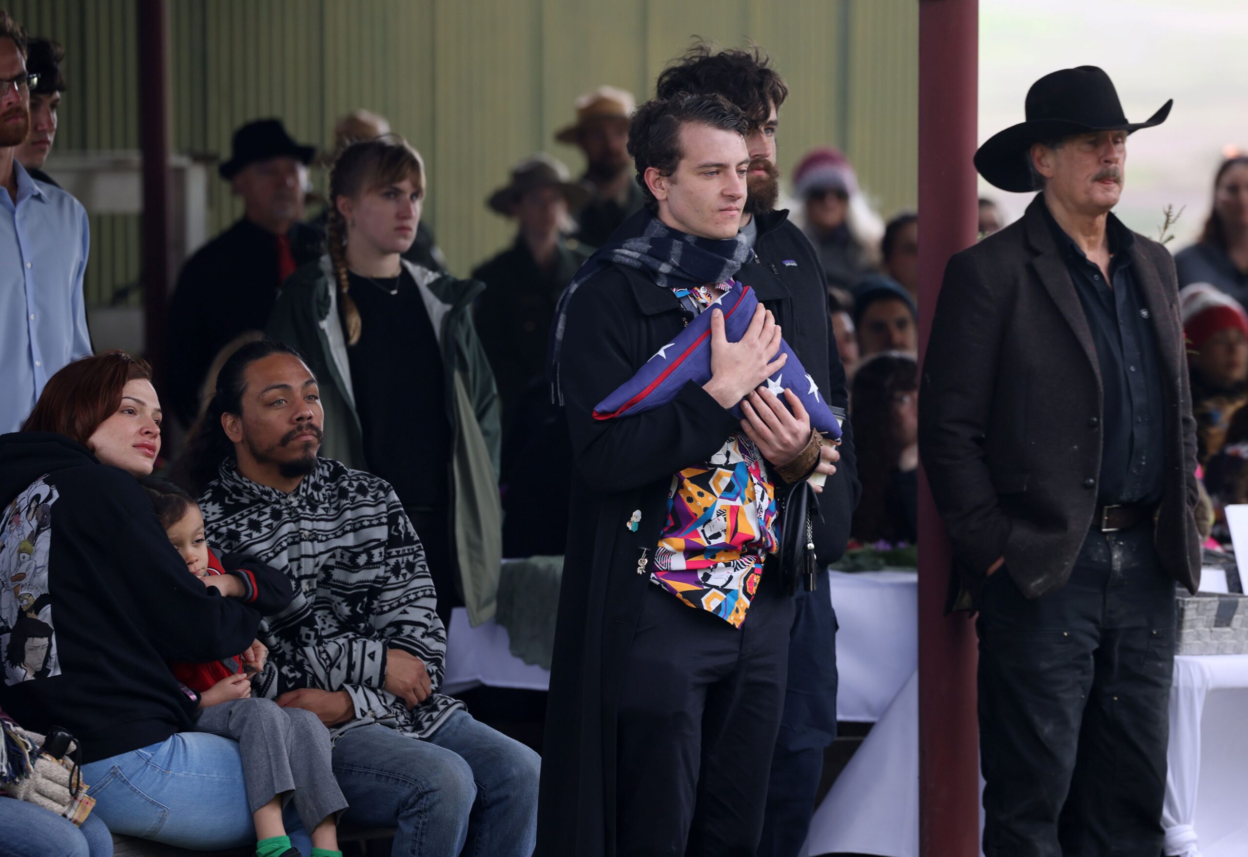 Seth Pringle, son of Katranne Pringle, holds an American flag presented to him by the Sonoma County Fire District honor guard during a celebration of life event remembering Katranne Pringle at Tolay Lake Regional Park in Petaluma Sunday, March 30, 2025. (Beth Schlanker / The Press Democrat)