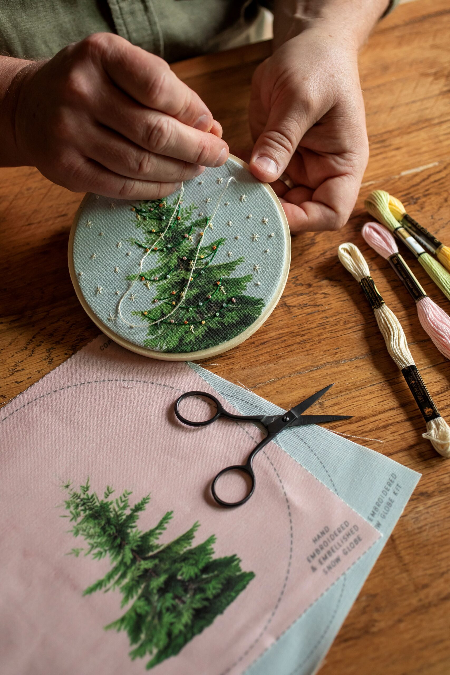 Embroidery artist Robert Mahar stitches together one of his art projects