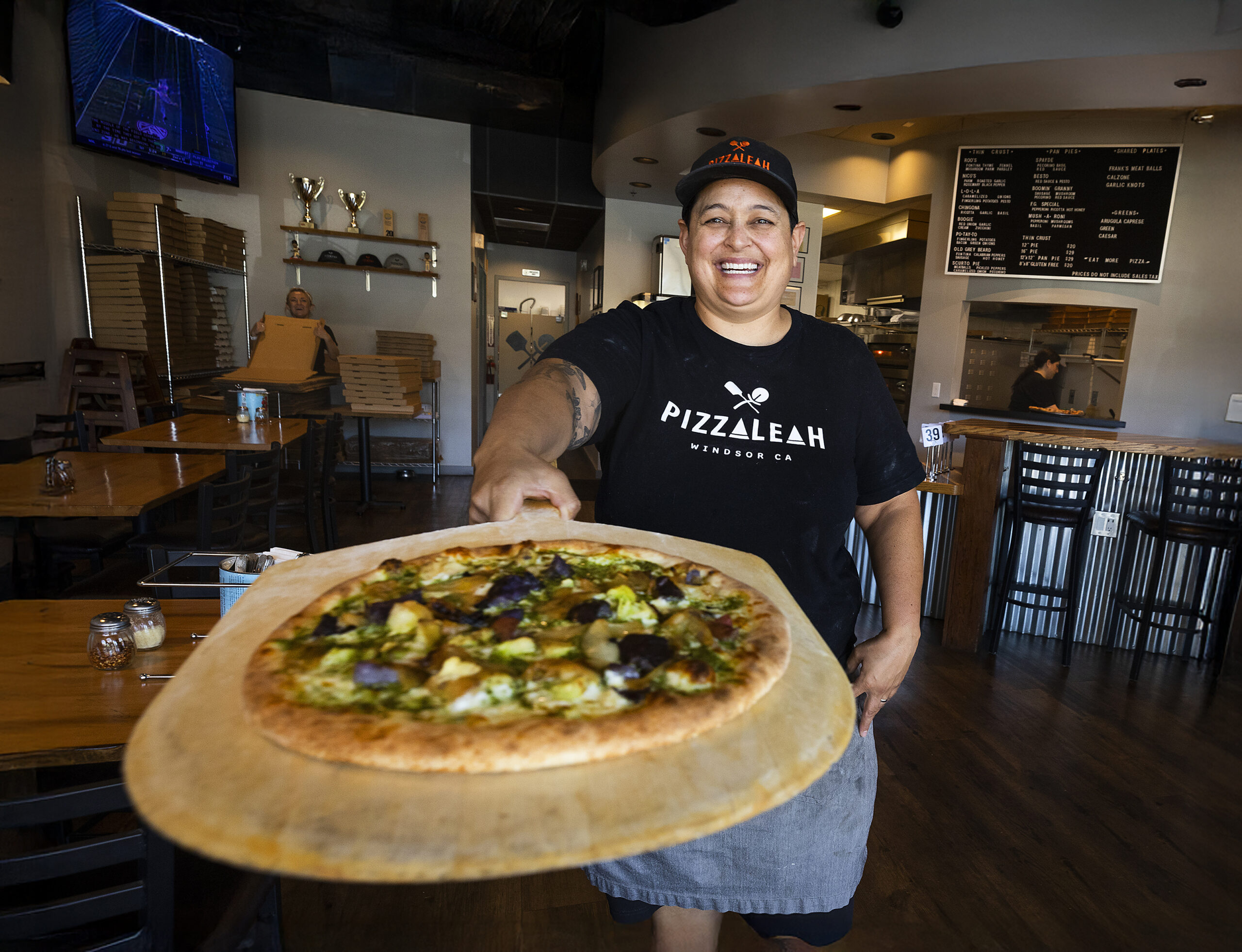Leah Scurto, owner of PizzaLeah in Windsor, serves up one of her award winning pizzas.