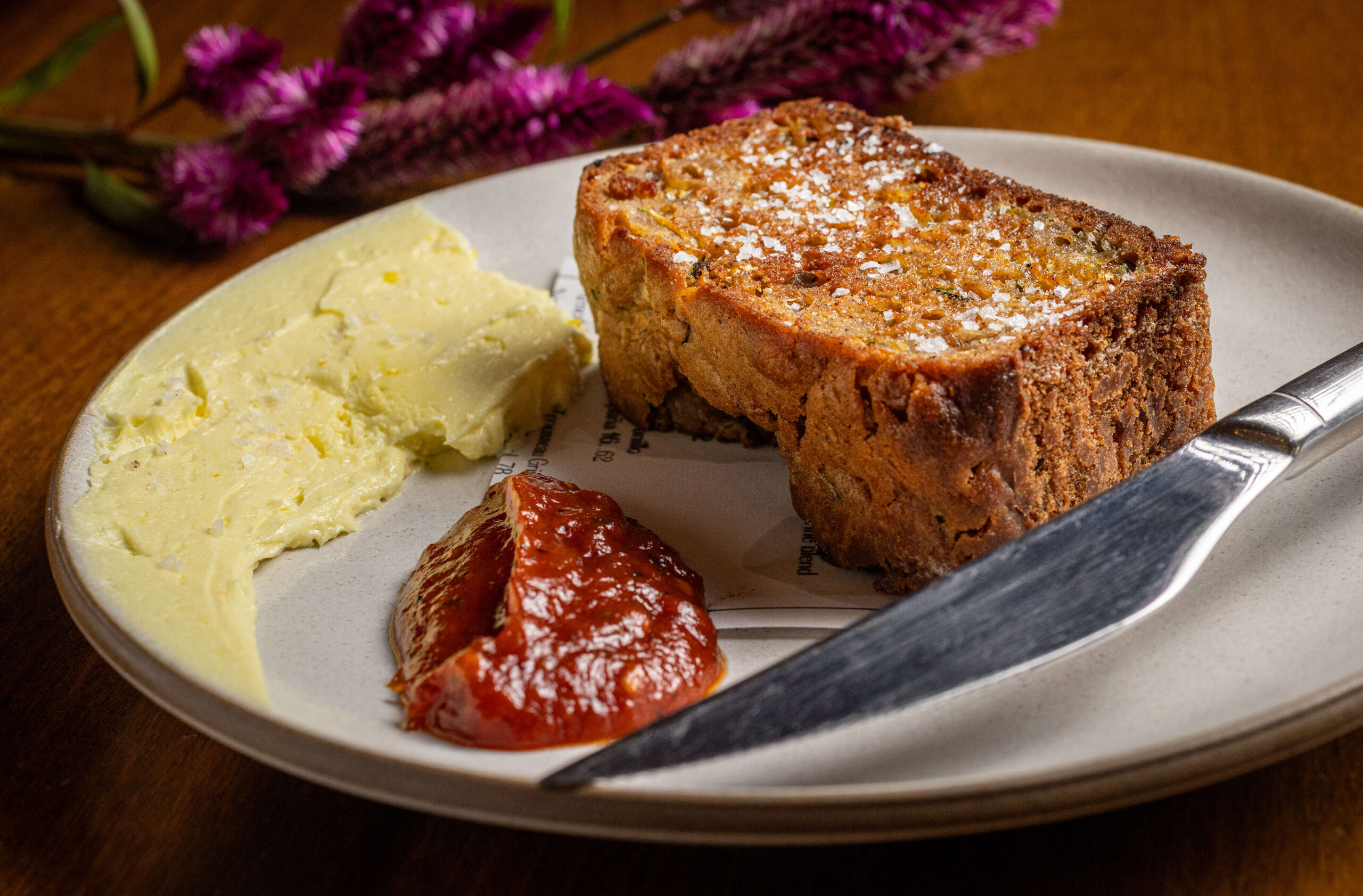 Warm zucchini bread with tomato jam and corn butter from Street Social Thursday, August 14, 2025, in Petaluma. (John Burgess / The Press Democrat)