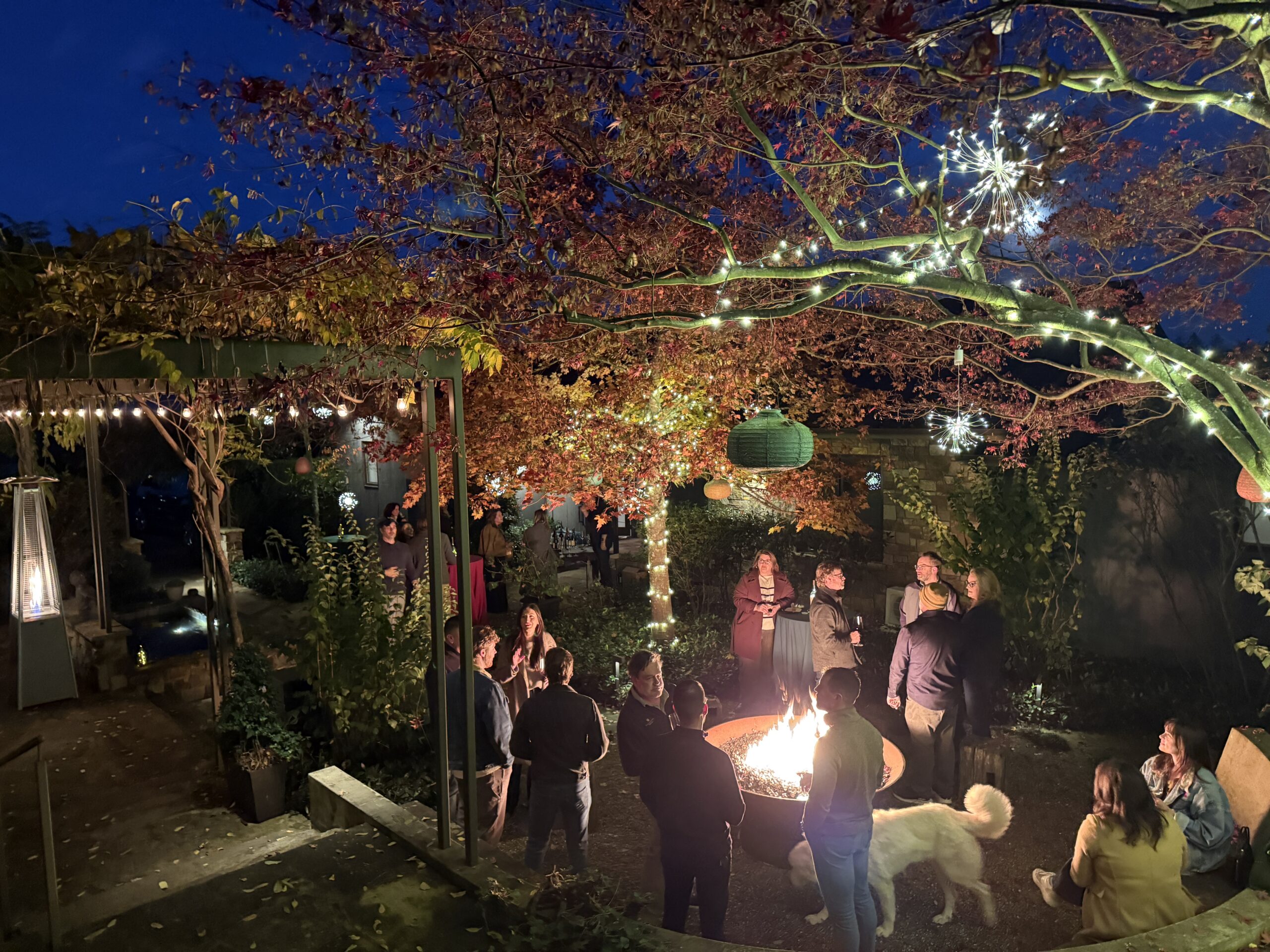 Sommeliers gather around a fire pit during the Blind Bottle Bash at Flambeaux Wine in Healdsburg. (Courtesy of TOWN)