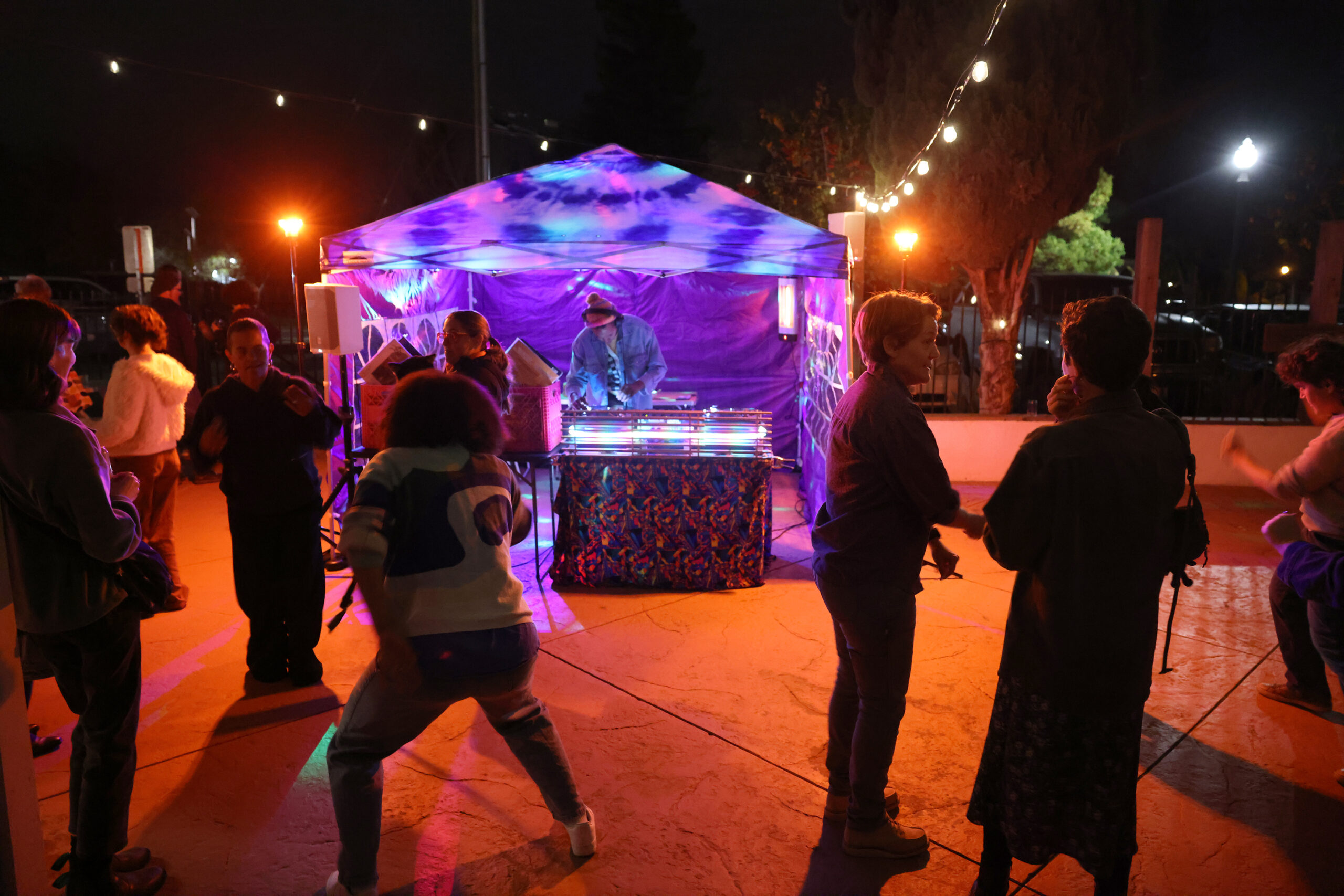 Guests dance during the Queer Soup Night event at Slow Co. Pizza in Cotati Sunday, Nov. 23, 2025. (Beth Schlanker / The Press Democrat)