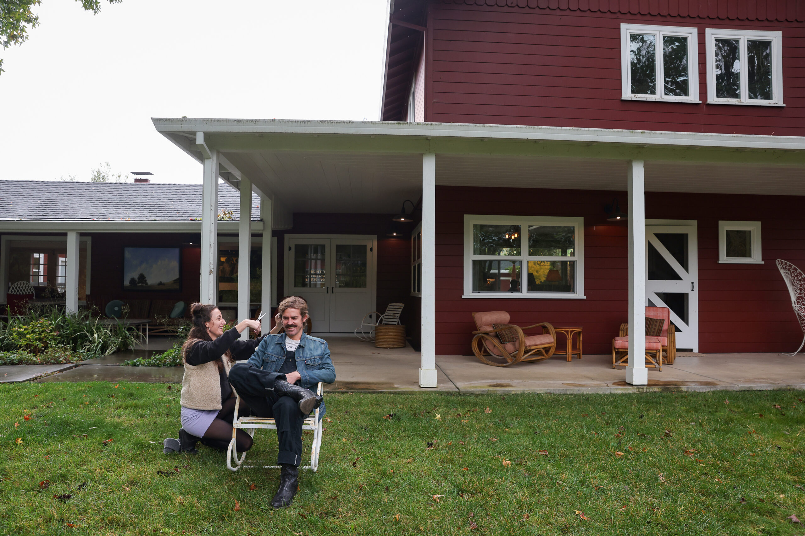 Desiree Cannon Doores, left, cuts her husband Sam Doores’ hair at the Little Saint Farm before their performance at Little Saint in Healdsburg on Thursday, November 13, 2025. Sam Doores is in the band The Deslondes. Desiree Cannon Doores, who performs under the name Desiree Cannon, is the opening act for the band. (Christopher Chung/The Press Democrat)