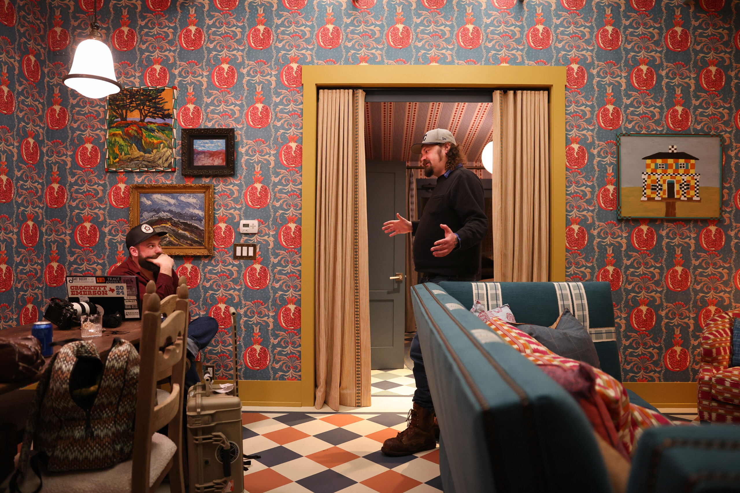 The Deslondes manager Mike Vanata, left, and band member Riley Downing relax in a room at The Cottages at Little Saint before the band’s performance in Healdsburg on Thursday, November 13, 2025. (Christopher Chung/The Press Democrat)