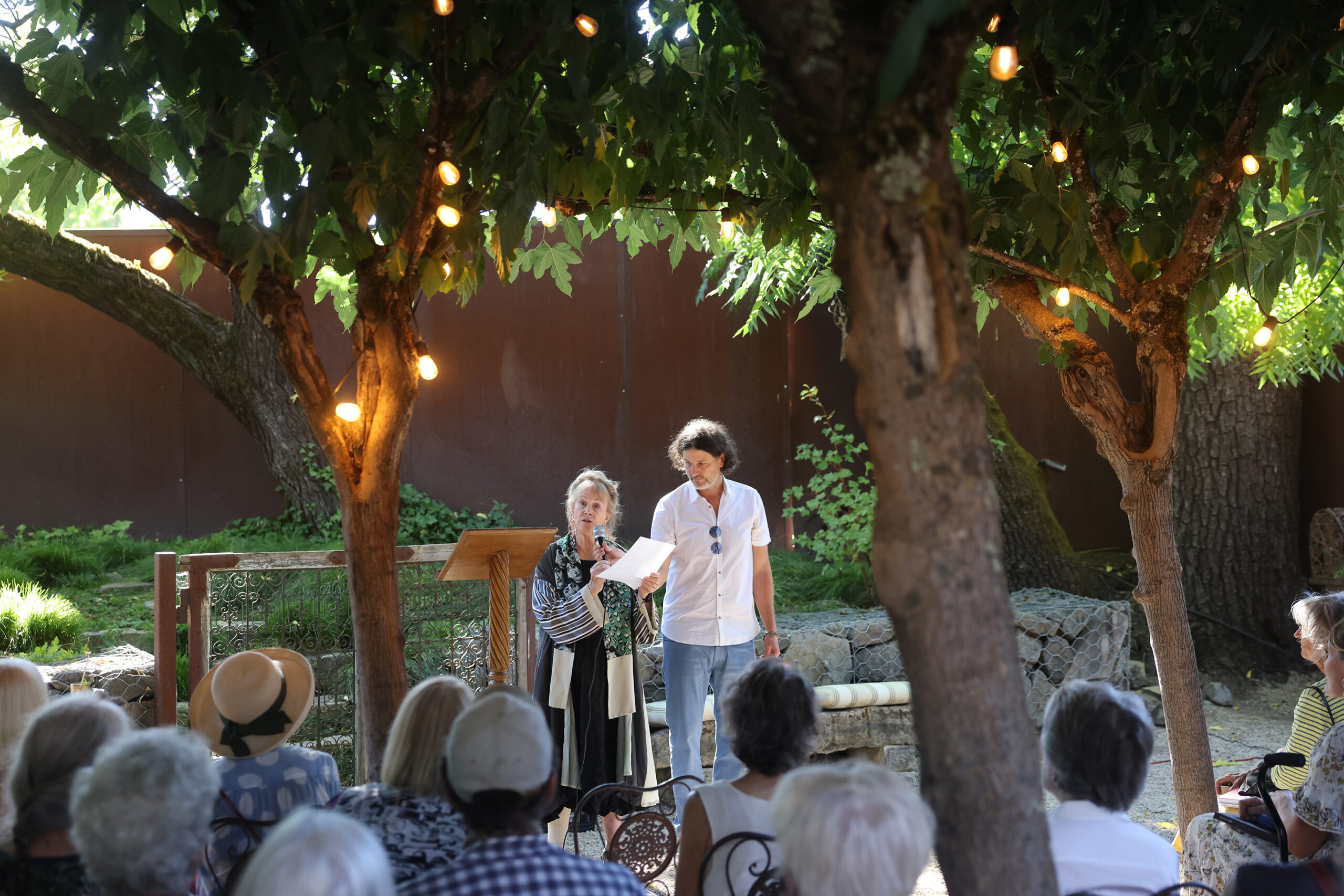 Artist Susan Preston speaks before a crowd during a launch party for her book “In Ghost Time: The Art and Stories of Susan Preston” at Barndiva in Healdsburg Sunday, Sept. 14, 2025. (Beth Schlanker / The Press Democrat)