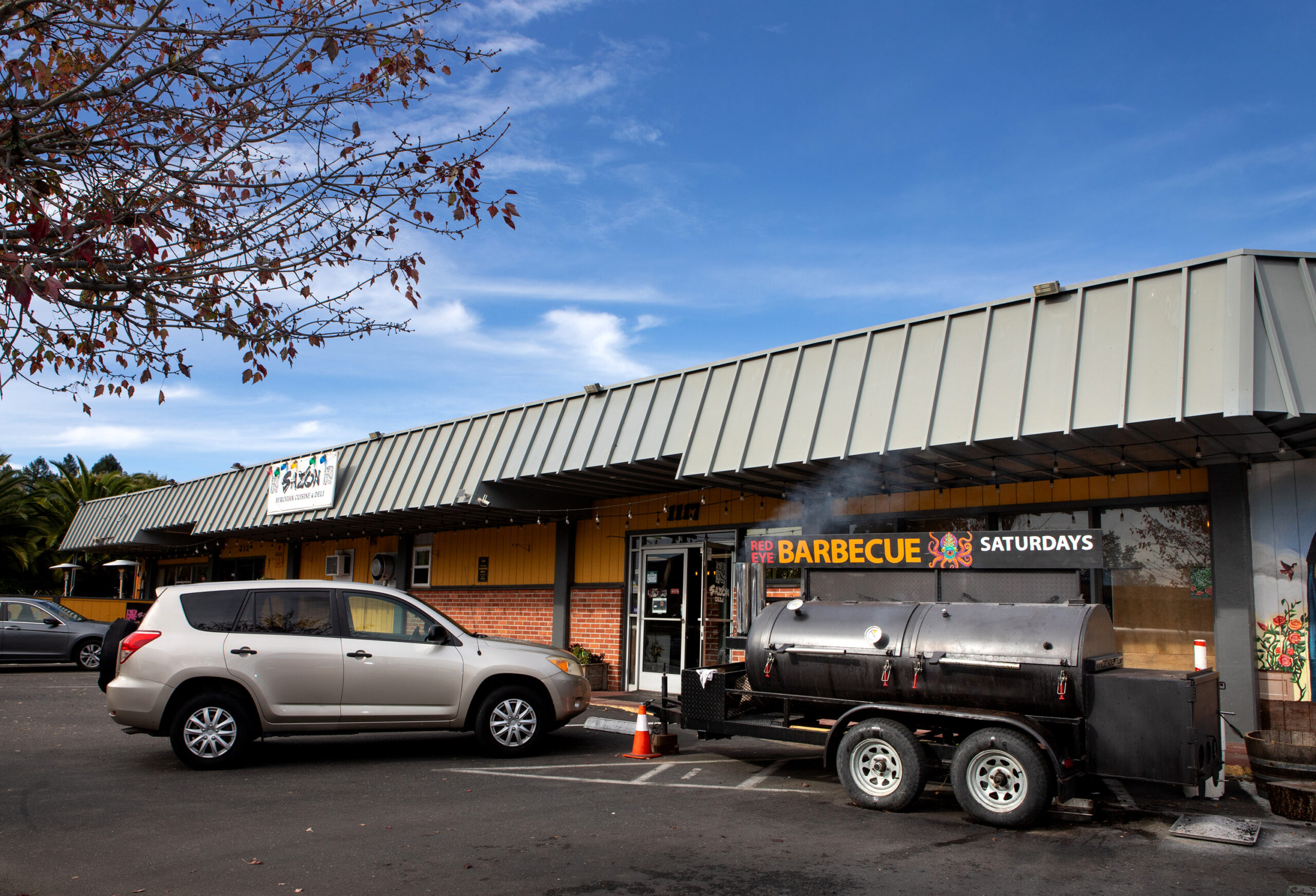 Bob Costarella’s “Red Eye Barbecue” pop-up locates his smoker where he serves food in front of Sazon Peruvian Cuisine & Deli on Saturday, November 15, 2025. (Darryl Bush / For The Press Democrat)
