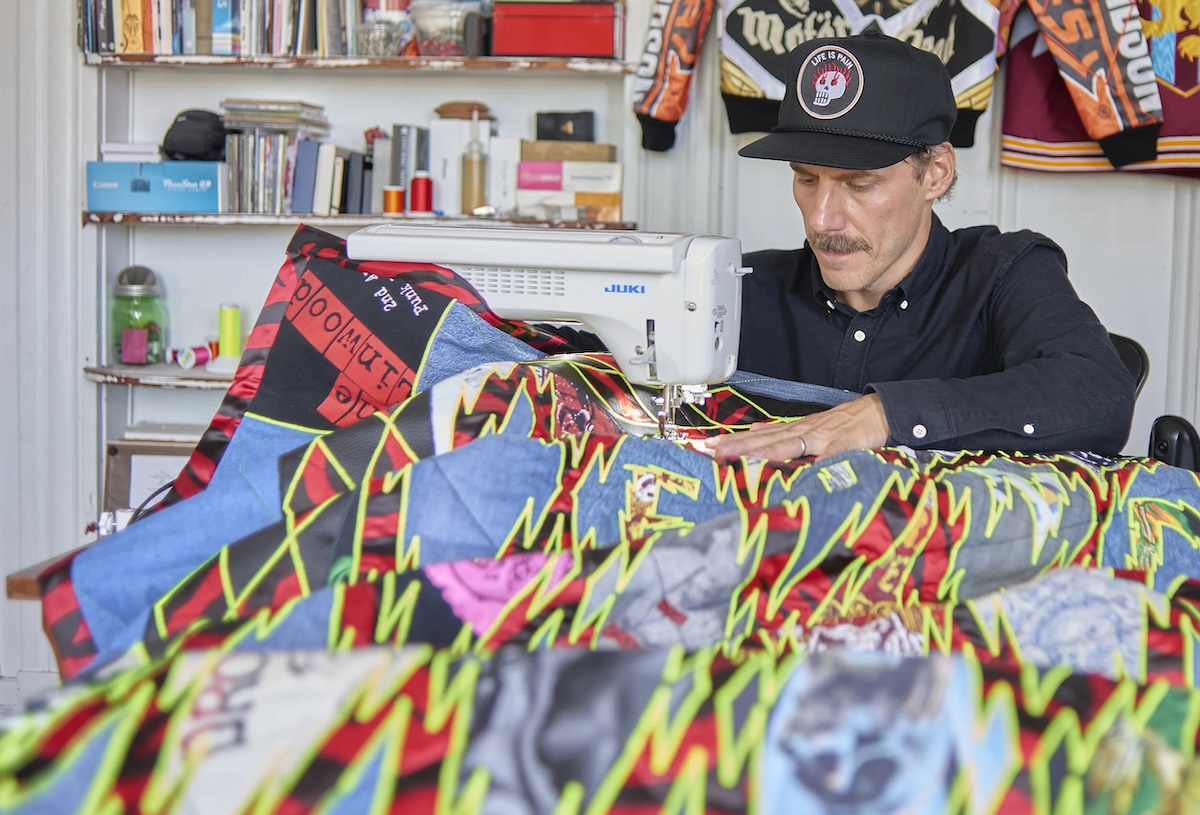 Ben Venom sews a curtain