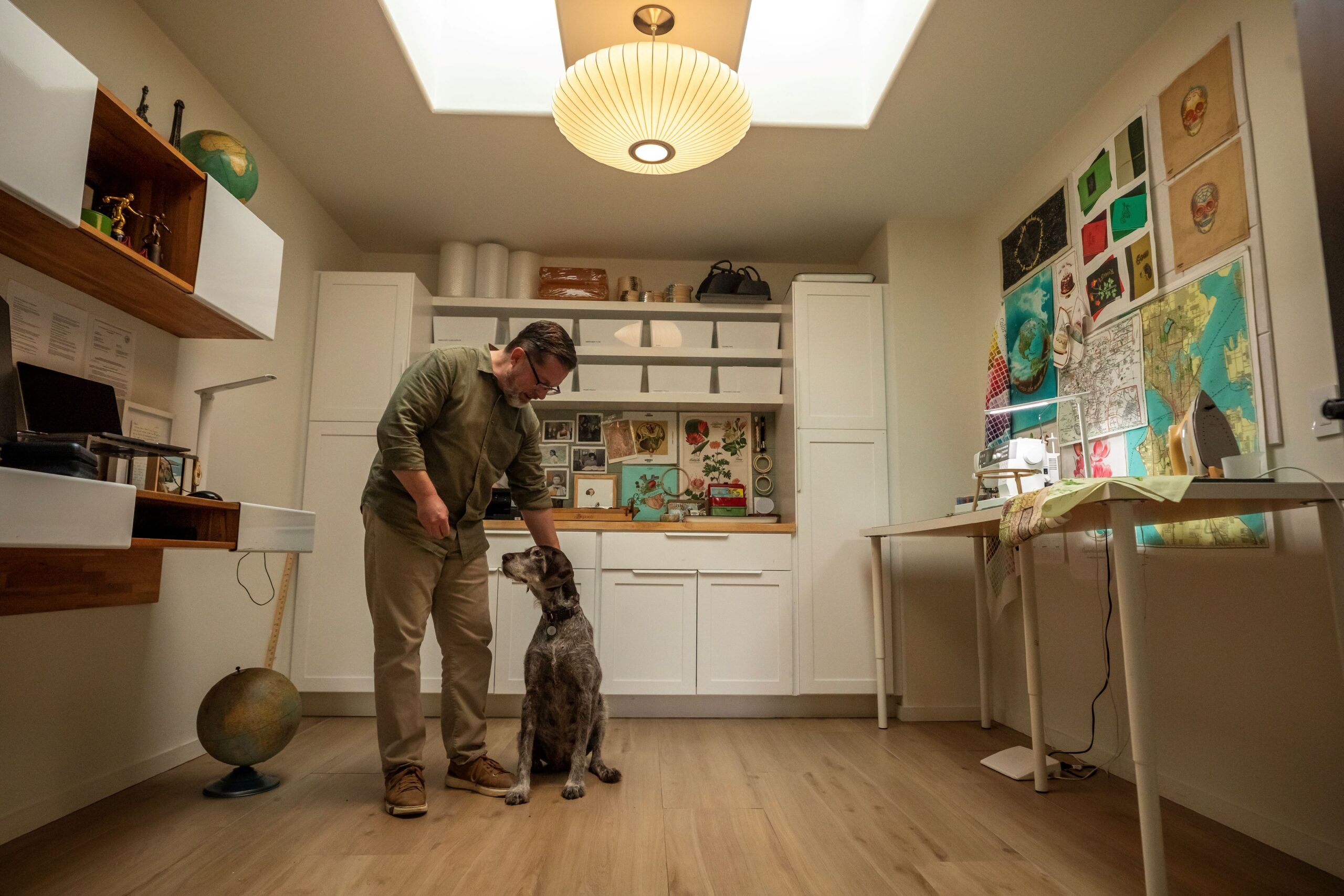 Embroidery artist Robert Mahar with his senior rescue dog