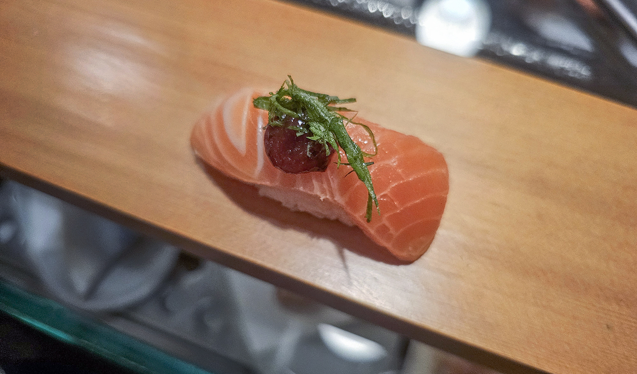 Salmon with plum and shiso at Sushi Kosho's nine-piece nigiri tasting. (Heather Irwin / The Press Democrat)