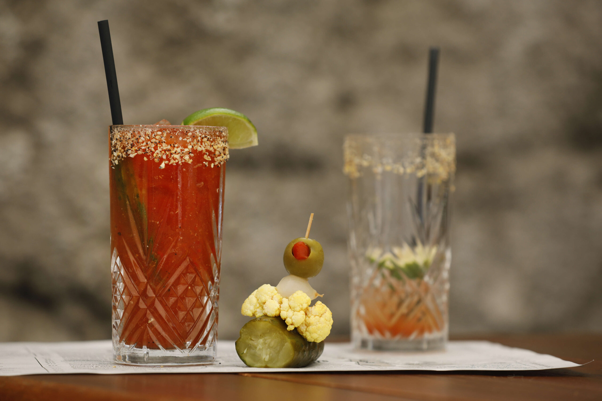 The Bloody Maury garnished with dill pickle, lime, olive, pickled cauliflower and onion, and a rim of Everything Bagel Seasoning at Grossman's Noshery and Bar in Santa Rosa, on Thursday, March 17, 2022. (Beth Schlanker/The Press Democrat)
