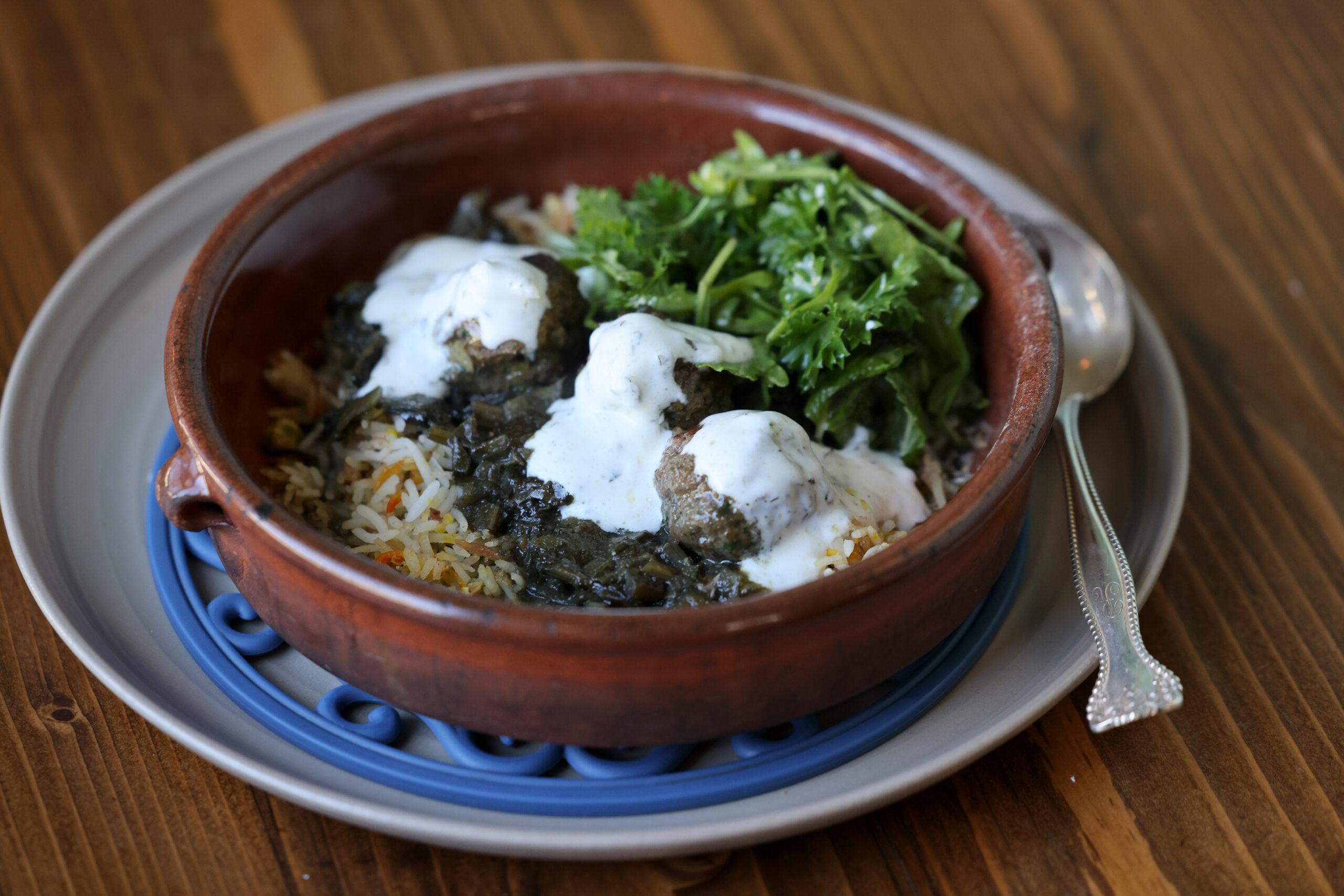 Persian meatball tagine over a bed of jeweled saffron rice and topped with yogurt and fresh herbs at Pearl Petaluma in Petaluma Thursday, Jan. 8, 2026. (Beth Schlanker / The Press-Democrat)