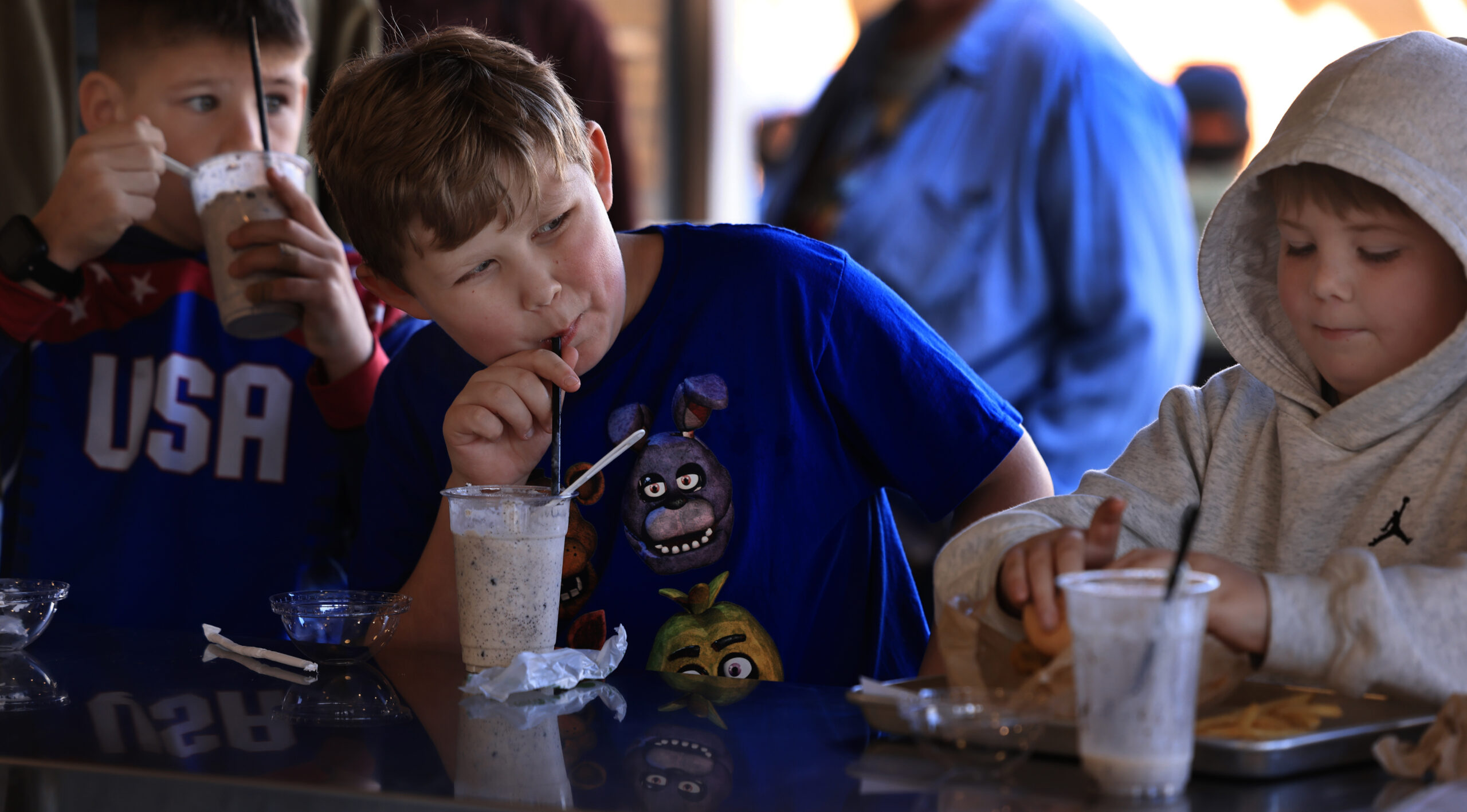 From left, friends Johny Miller, Tucker Hollowellan Sonny Hendricks, and Johnny Miller wait for their orders Pick’s Roadside in Cloverdale Saturday, Jan. 10, 2026. (Kent Porter / The Press Democrat)