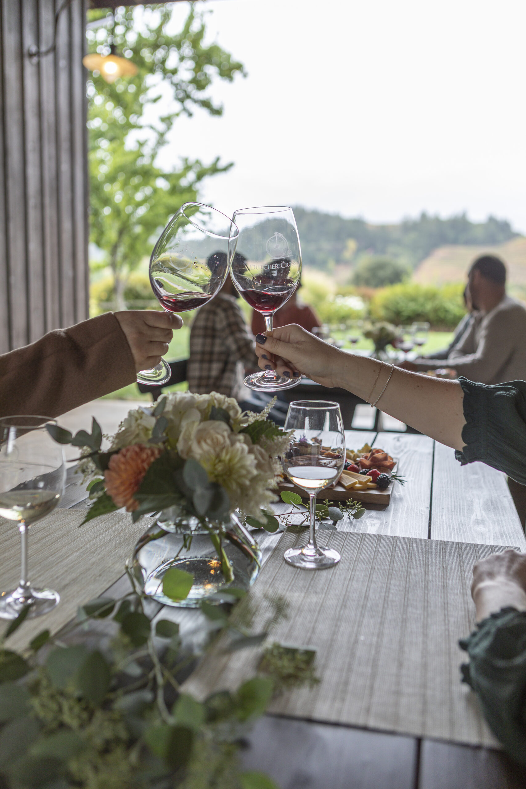 At Dutcher Crossing Winery in Geyserville, vineyard-facing tables sit in a covered breezeway, beneath a pergola, on a paved patio and alongside a pétanque court. Wine Country doesn’t get much prettier than this. (Dan Quinones)