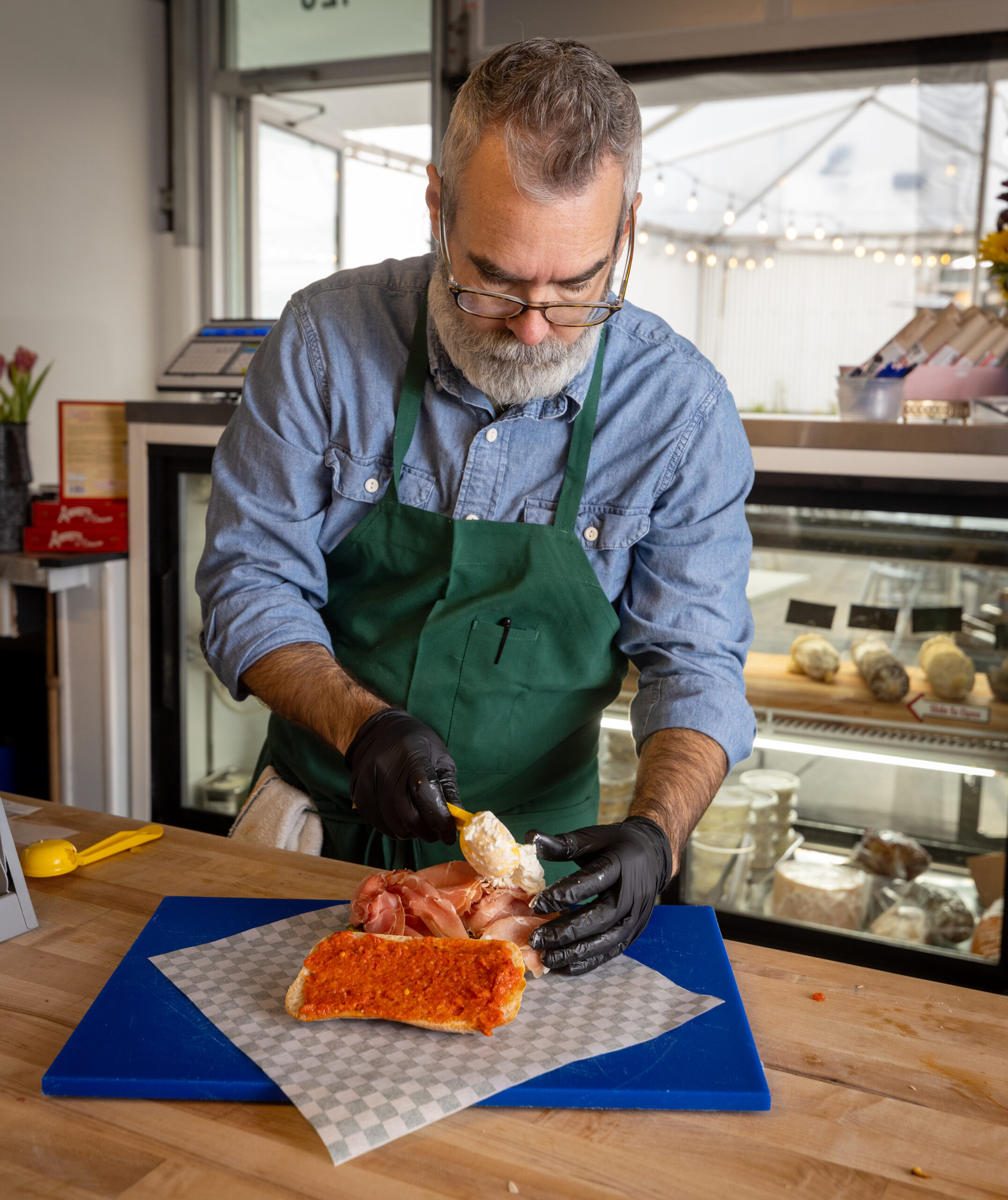 making a sandwich at Genero’s Deli in Sebastopol’s Barlow district