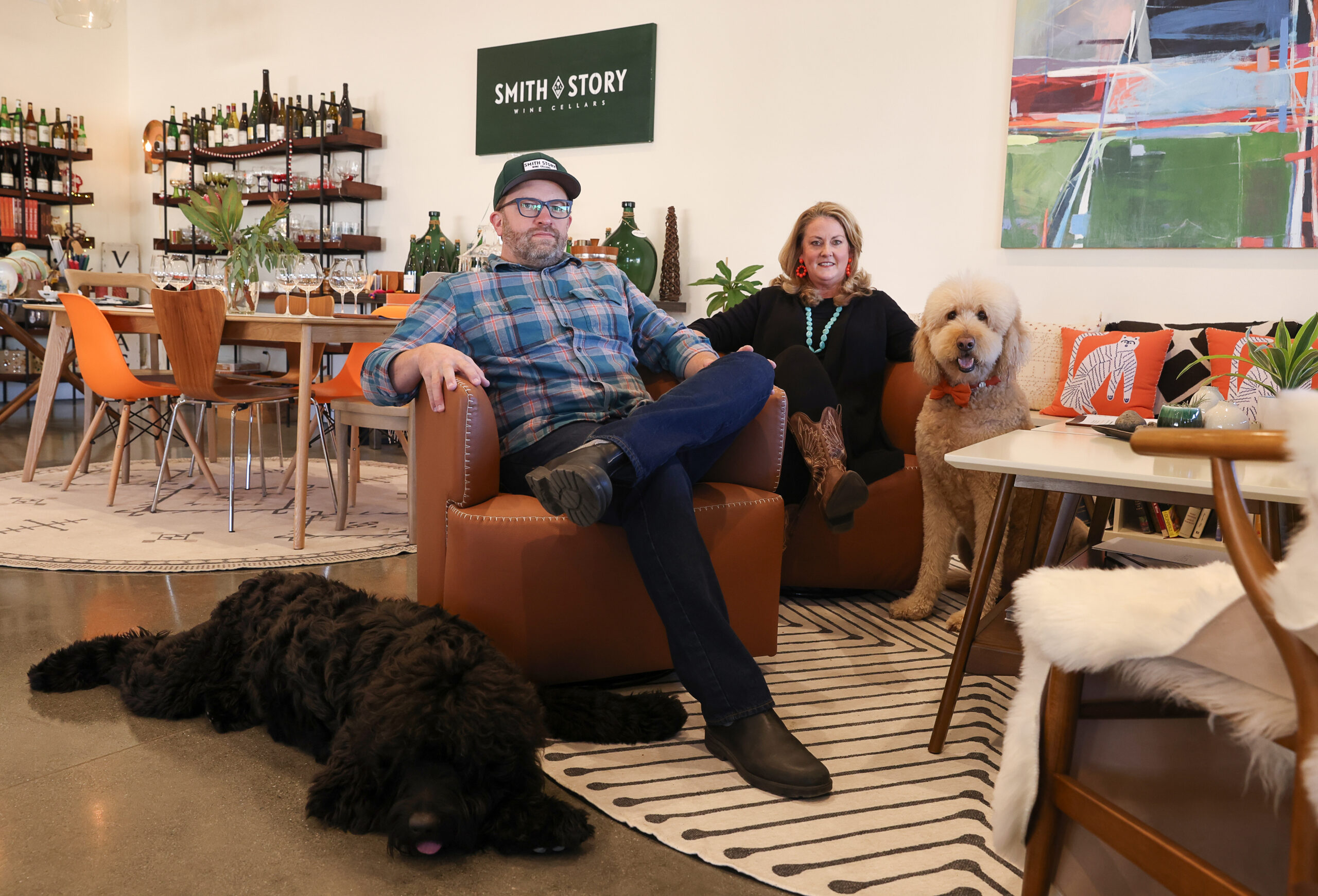 Eric Story and Ali Smith-Story, with their dogs Sir Royal Soup, left, and Lord Sandwich at their Smith Story Wine Cellars location in Healdsburg on Monday, December 11, 2023. (Christopher Chung/The Press Democrat)