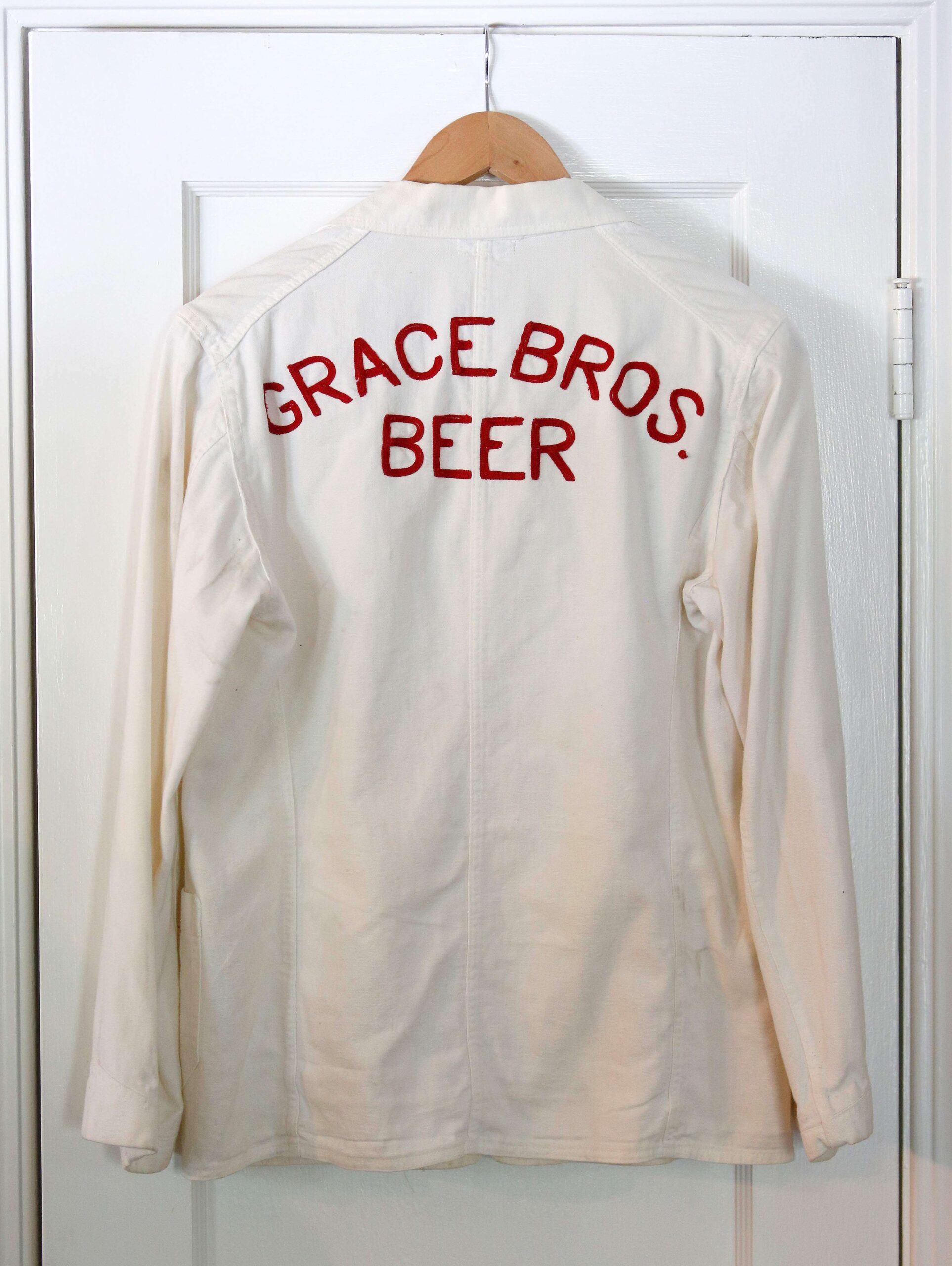 A vintage Grace Bros. Beer company coat owned by John Burton, at his home in Santa Rosa, on Tuesday, May 2, 2017. (Alvin Jornada / The Press Democrat)