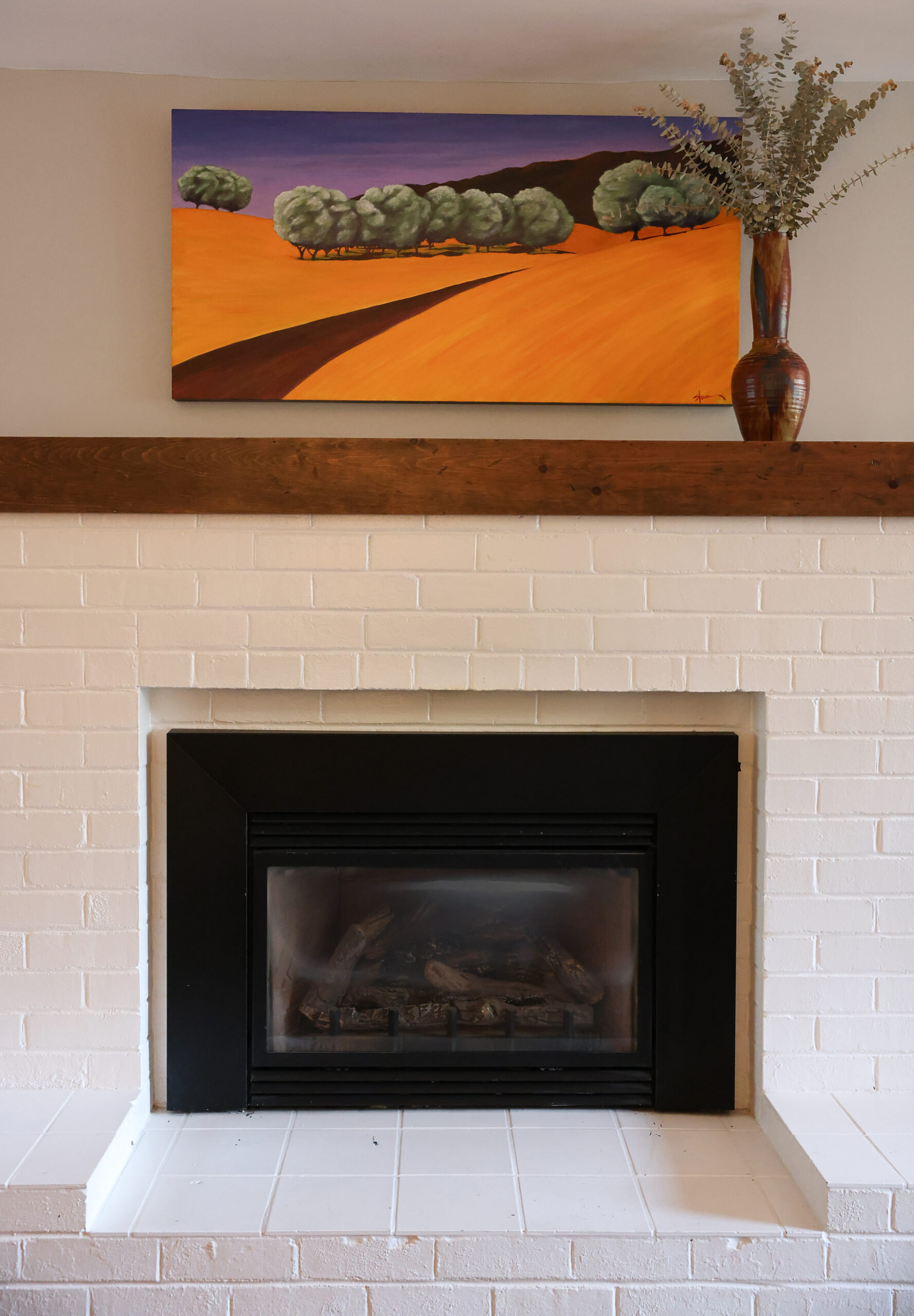 A painting by Stacia Brady, Ada Limón’s mother, hangs above the living room fireplace of her home in Glen Ellen on Wednesday, February 4, 2026. (Christopher Chung/The Press Democrat)