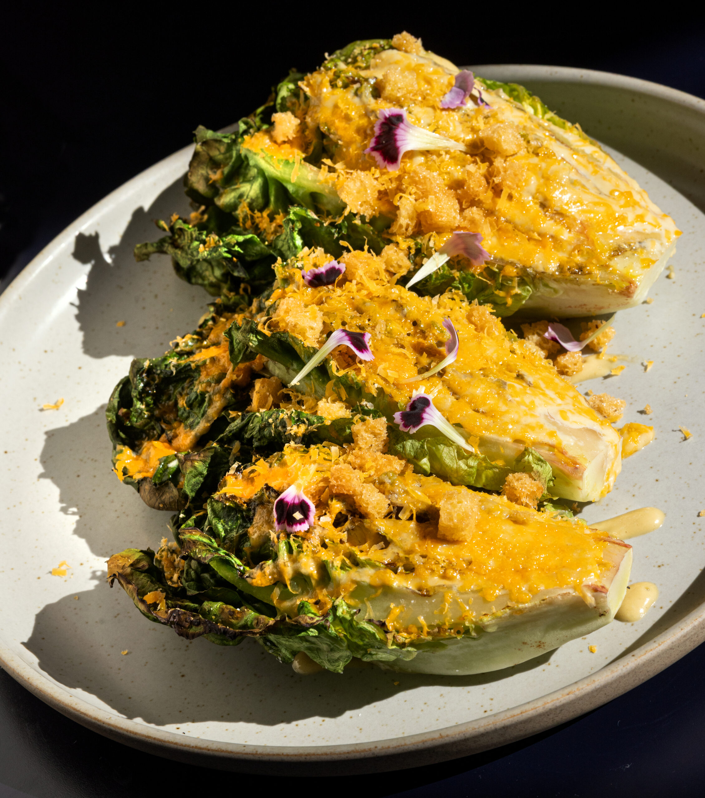 Grilled Caesar with sourdough croutons, grated mimolette cheese and lime from Juju’s, a French-Moroccan dinner pop-up in the Acorn Café space on the square in Healdsburg.