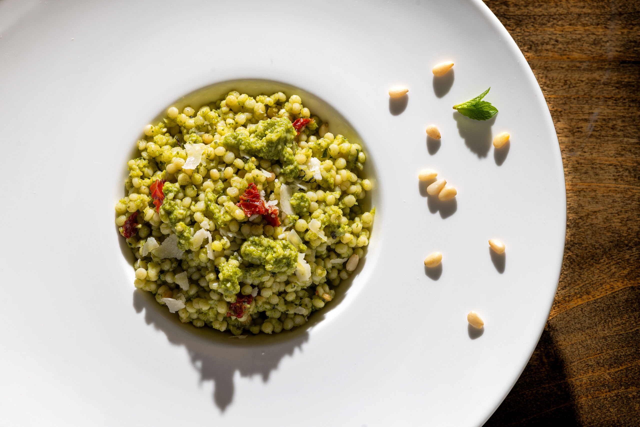 Couscous Salata with mint basil pistou, sun-dried tomato and Parmesan from the lunch-only menu at Mazza Levantine Kitchen Thursday, March 26, 2026 in northeast Petaluma. (John Burgess / The Press Democrat)