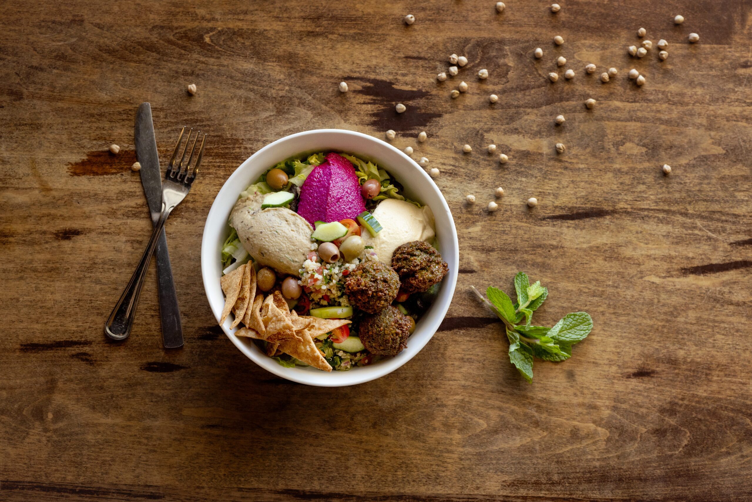 Maccabi Bowl with falafel, hummus, baba ganoush, beet & walnut dip, quinoa tabouleh, mixed greens and whole wheat chips from Zoftig Eatery Monday, March 30, 2026 in Santa Rosa. (John Burgess/The Press Democrat)