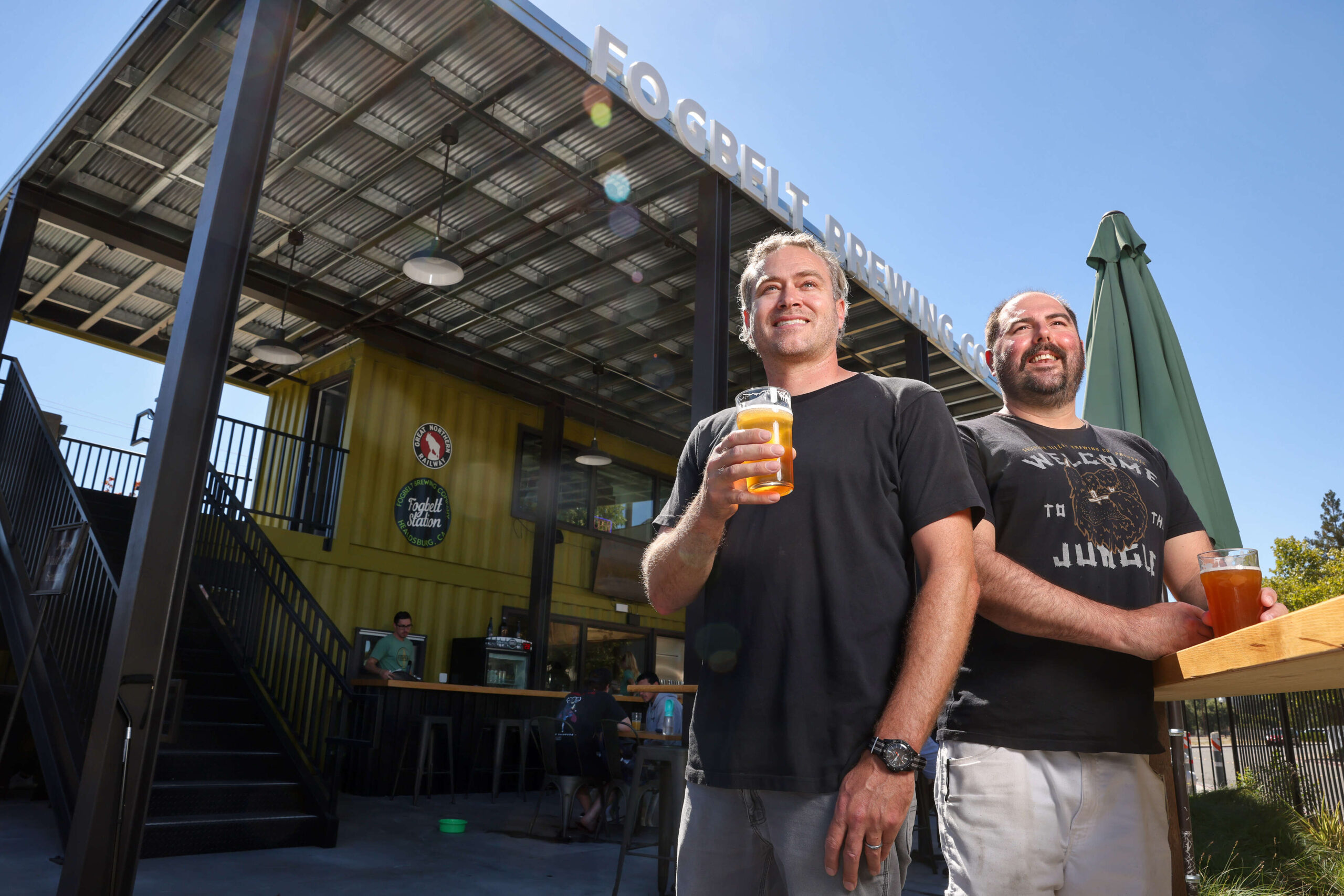 Fogbelt Brewing Company co-owners Paul Hawley, left, and Remy Martin at their Fogbelt Station beer garden in Healdsburg 