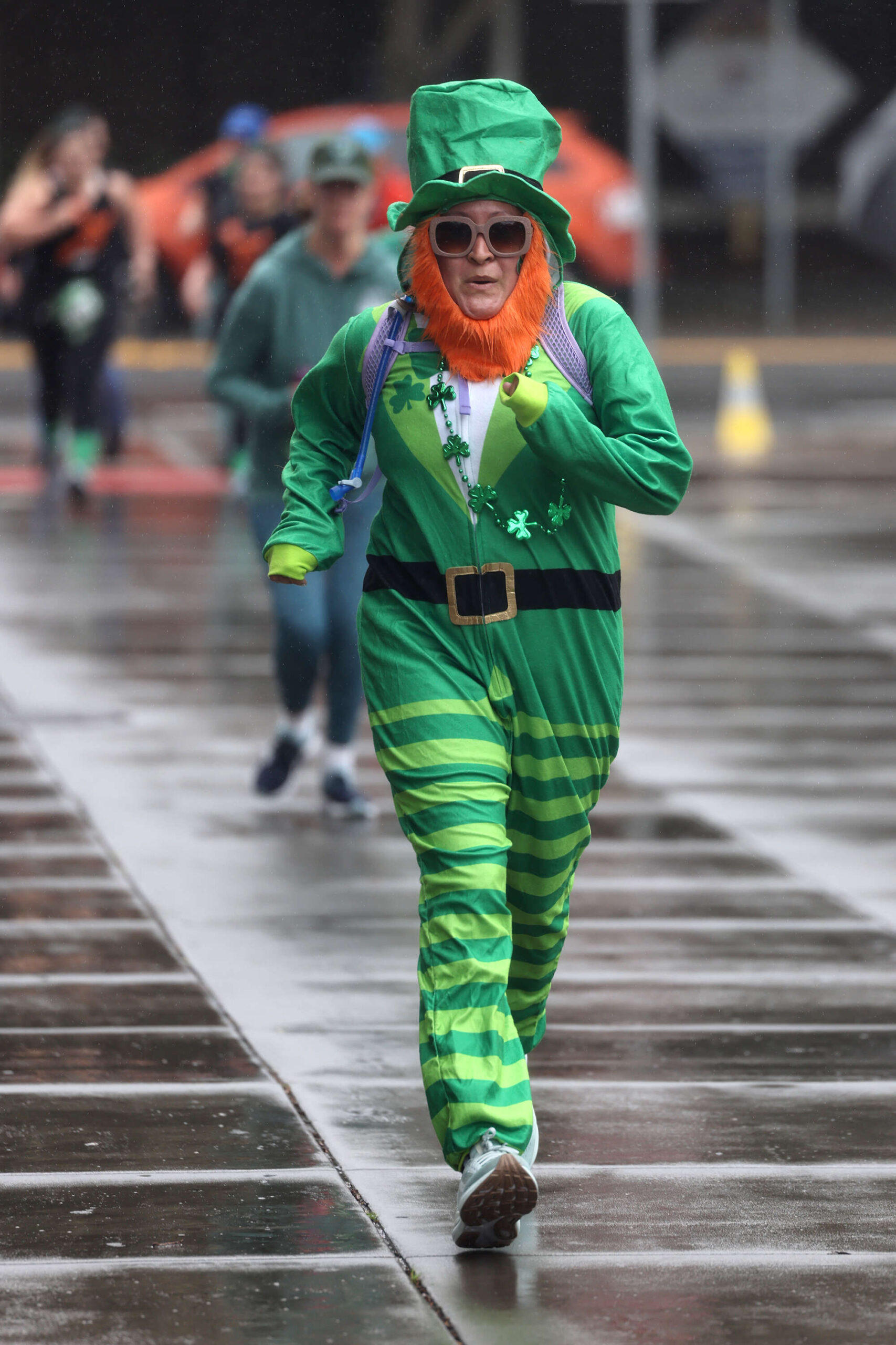 Laura Rodriguez nears the finish line dressed as a leprechaun during the St. Patrick’s Day 5k at Old Courthouse Square in Santa Rosa Sunday, March 16, 2025. (Beth Schlanker / The Press Democrat)
