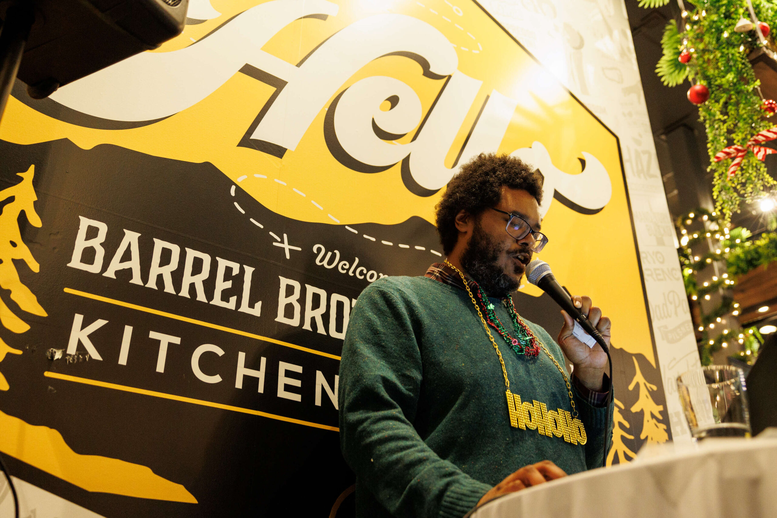 Trey Hart announces the questions for the Redwood Empire Food Bank’s Trivia Night at Barrel Brothers Brewing Kitchen & Cocktails in Windsor on Thursday, Dec. 14, 2023. (Abraham Fuentes / For The Press Democrat)