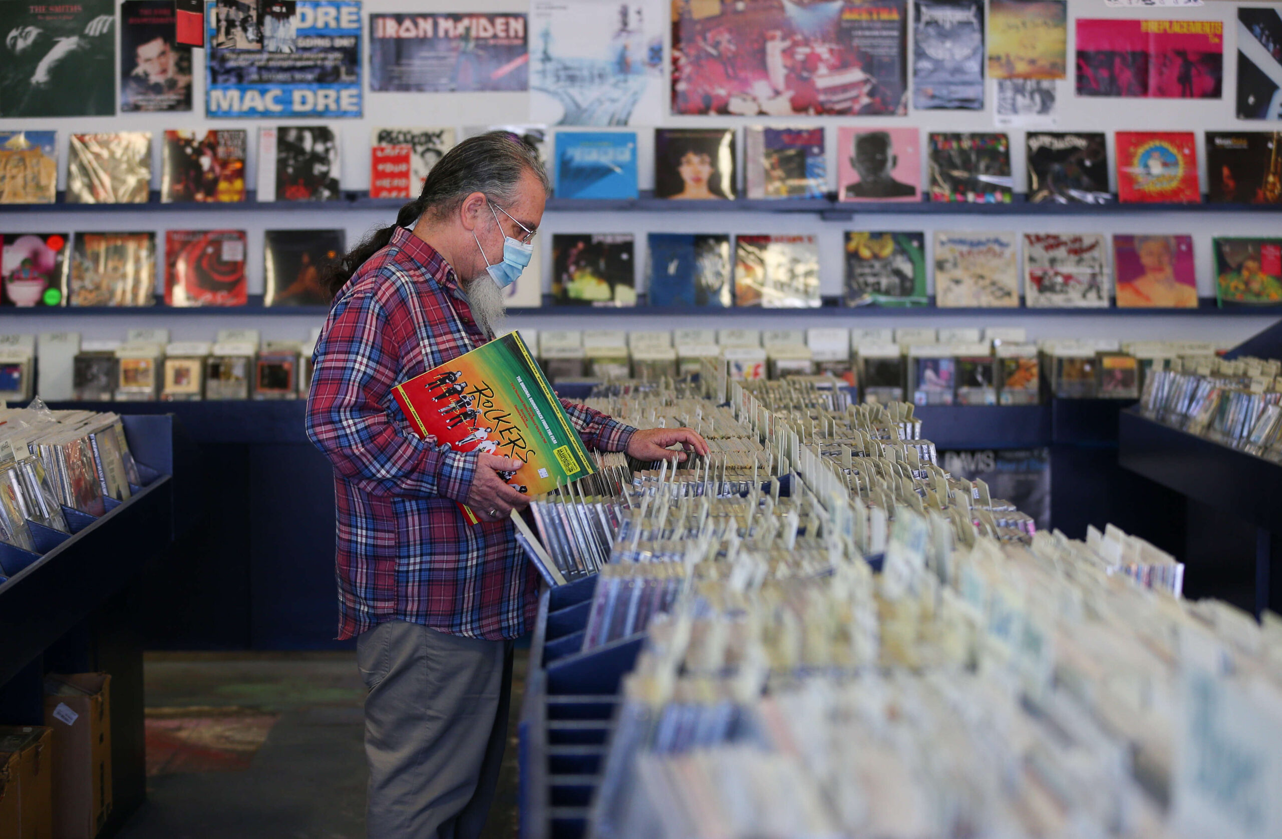 Rob Testorelli browses the selection at The Next Record Store in Santa Rosa on Tuesday, June 8, 2021. (Christopher Chung / The Press Democrat)
