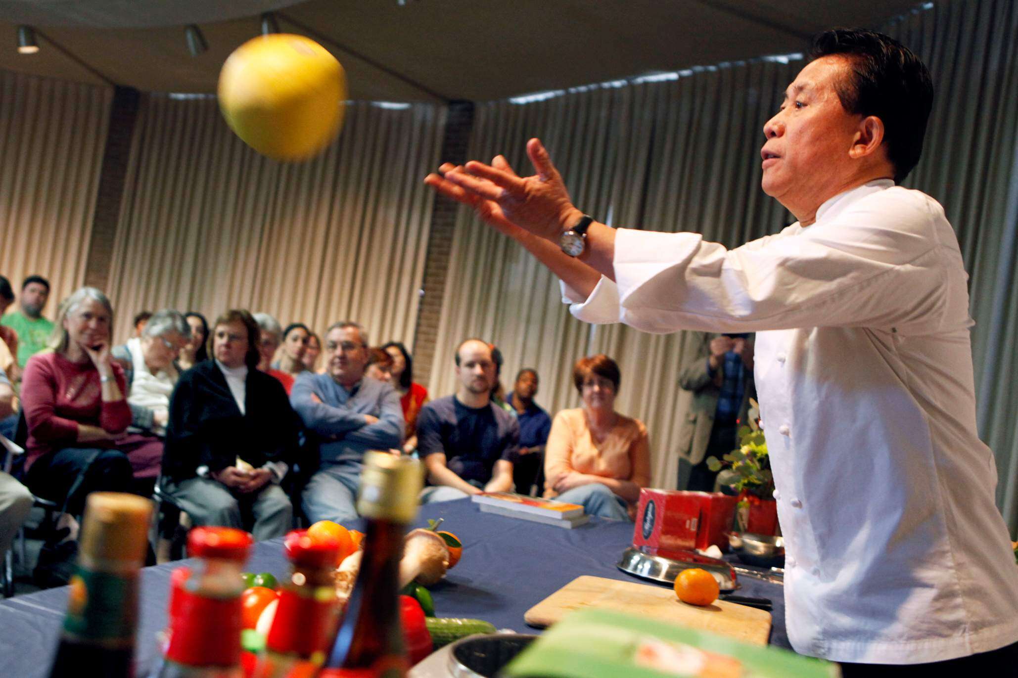 Celebrity chef Martin Yan hosting a food demonstration