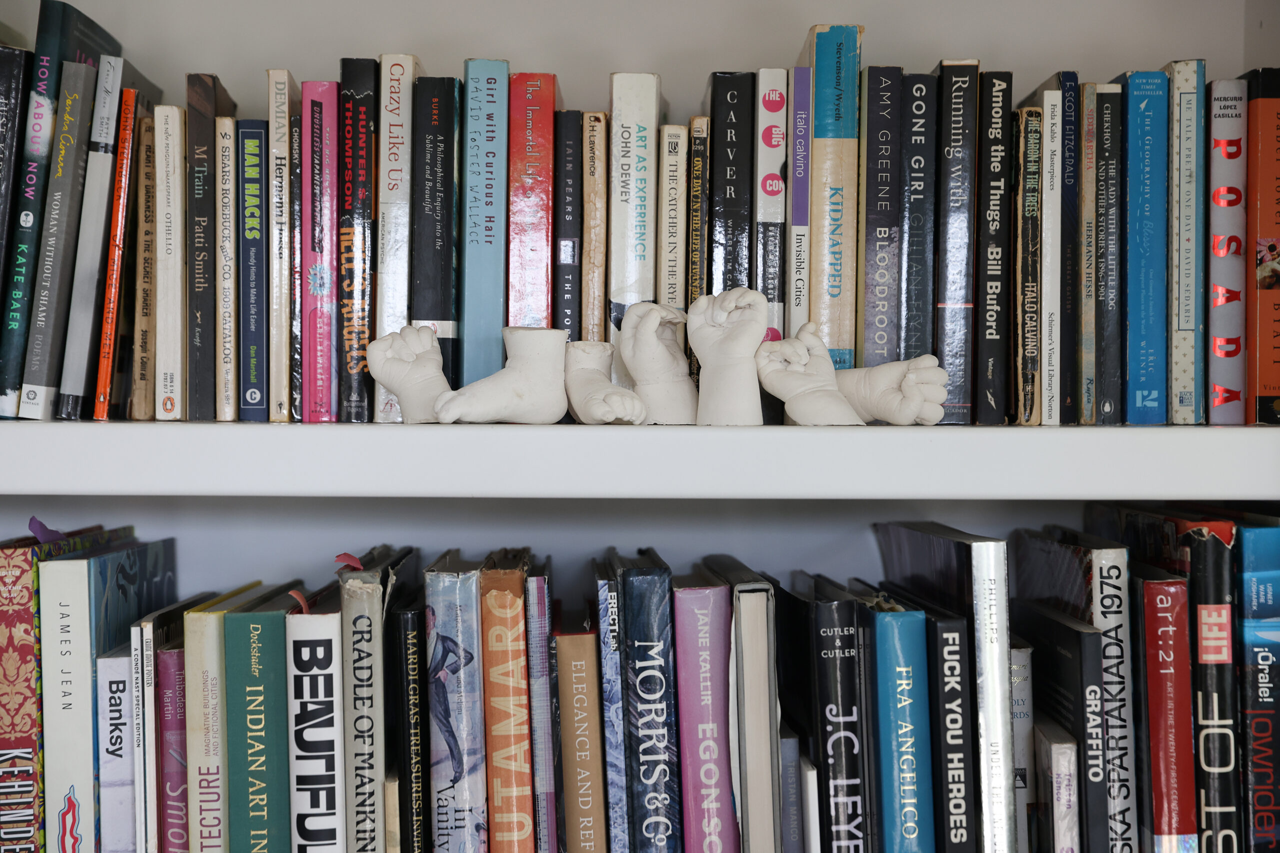 Books and homemade artwork in artist Jake Messing's home