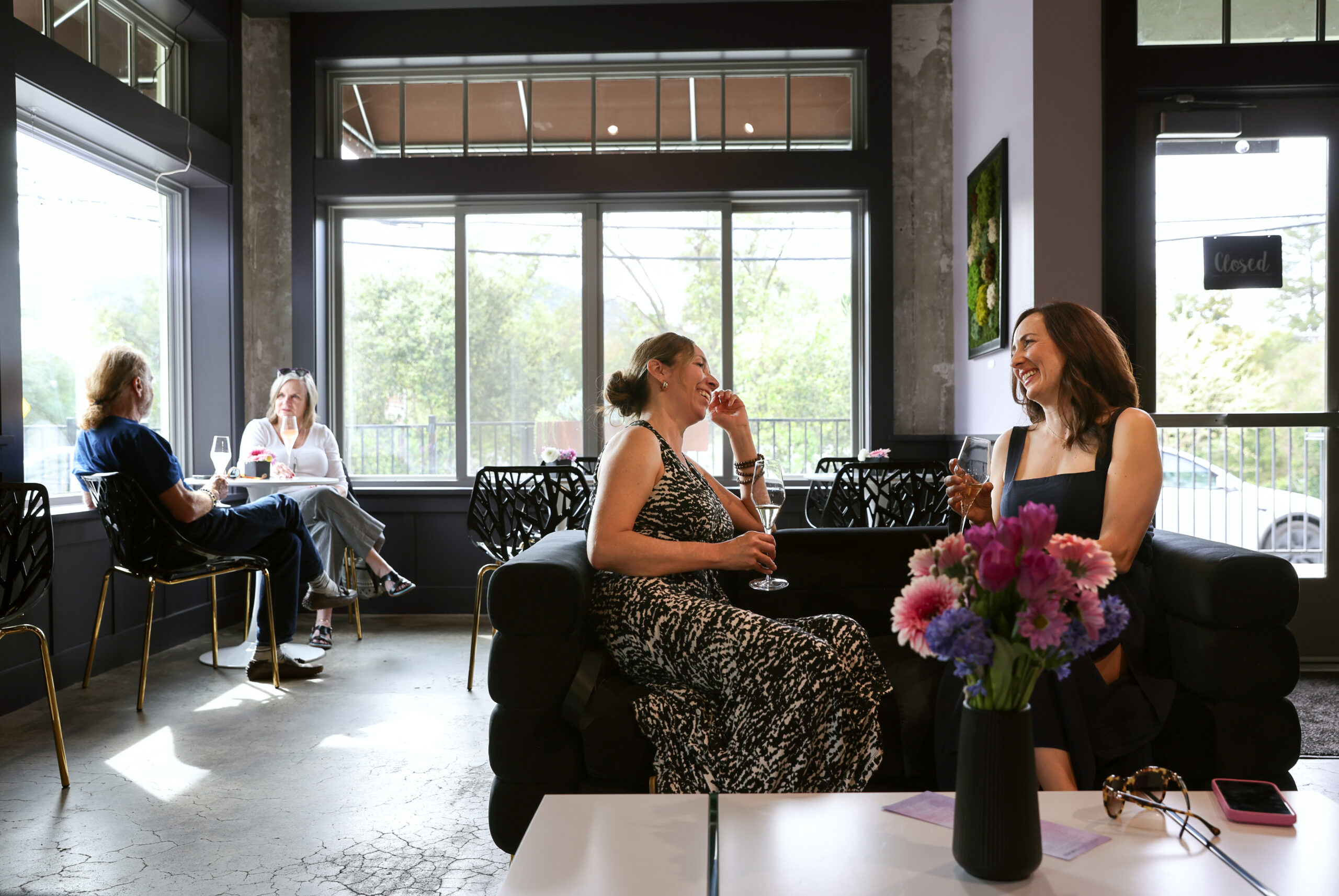 Melisa Hall, right, and Sonia Quintero enjoy a glass of wine at Wolves Lovers + Thieves in Glen Ellen