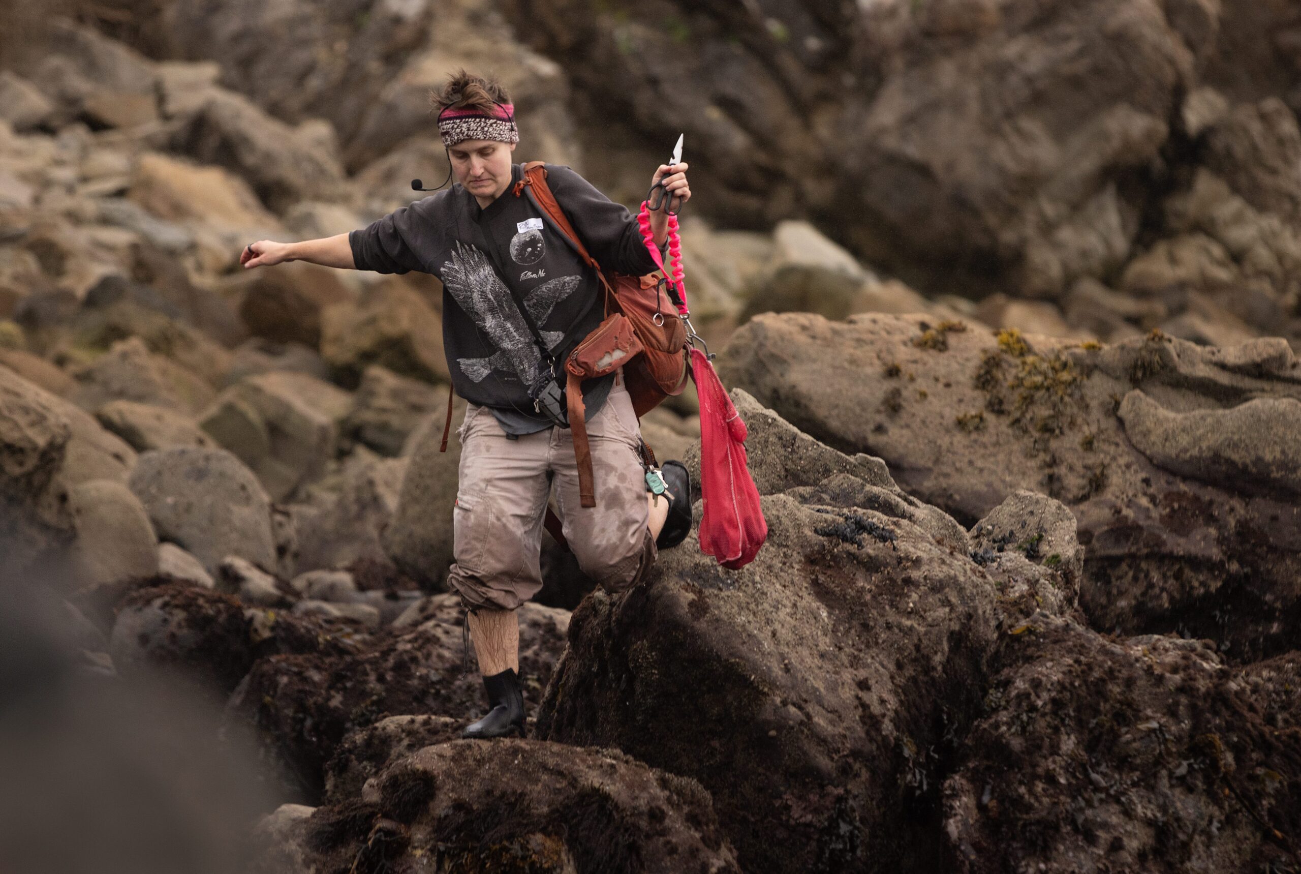 Fork in the Path instructor Ryn Sullivan heads to the beach with a bag of harvested purple urchins