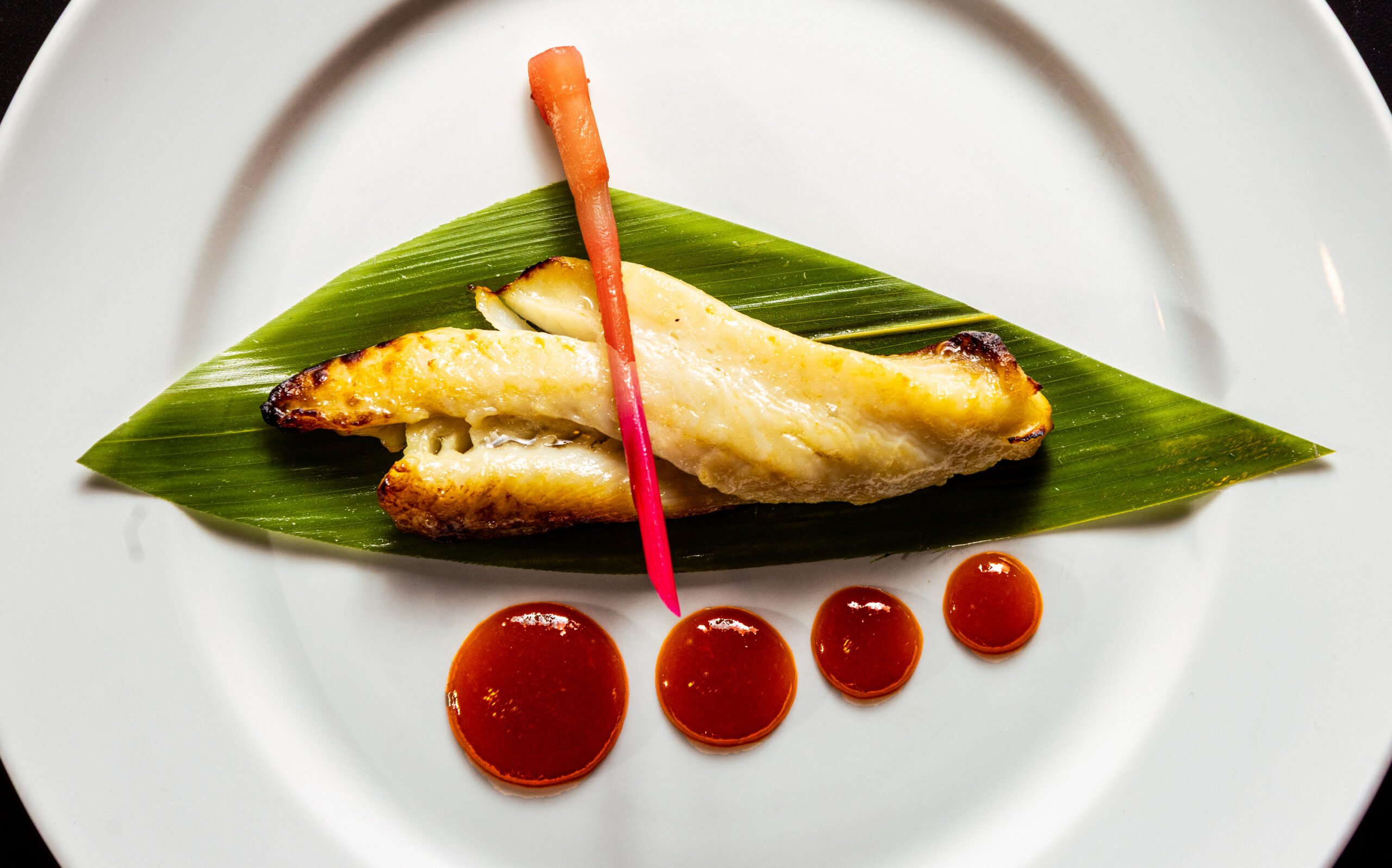 Saikyo Miso Black Cod appetizer with crispy pork wonton with tomato, onion and melted cheese from Osake Japanese restaurant Thursday, April 3, 2026 in Santa Rosa. (John Burgess / The Press Democrat)