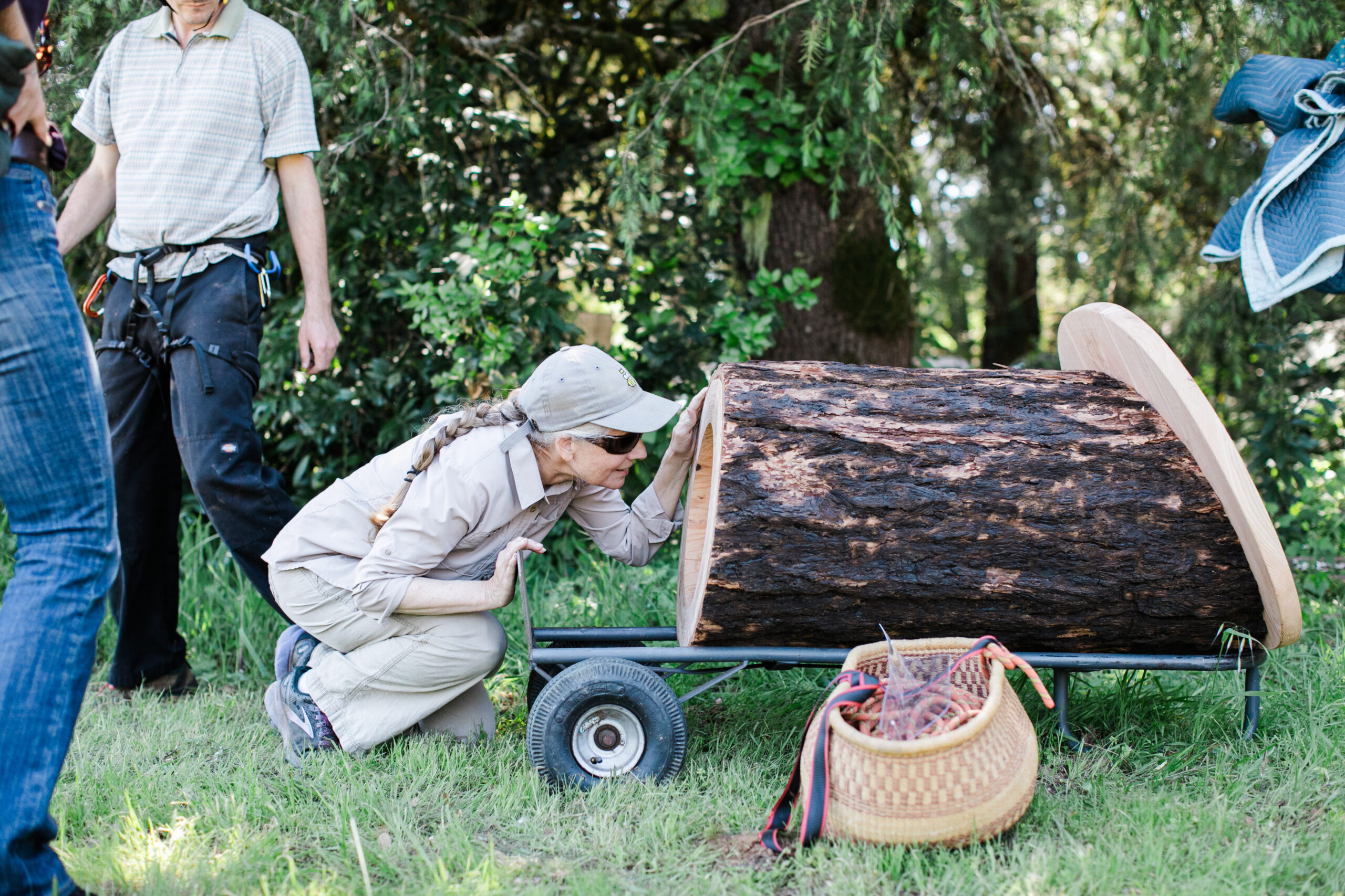 Laura Cheever, right, inspects an Apis Arborea TreeNest before it's installed at her Sebastopol apple farm. 