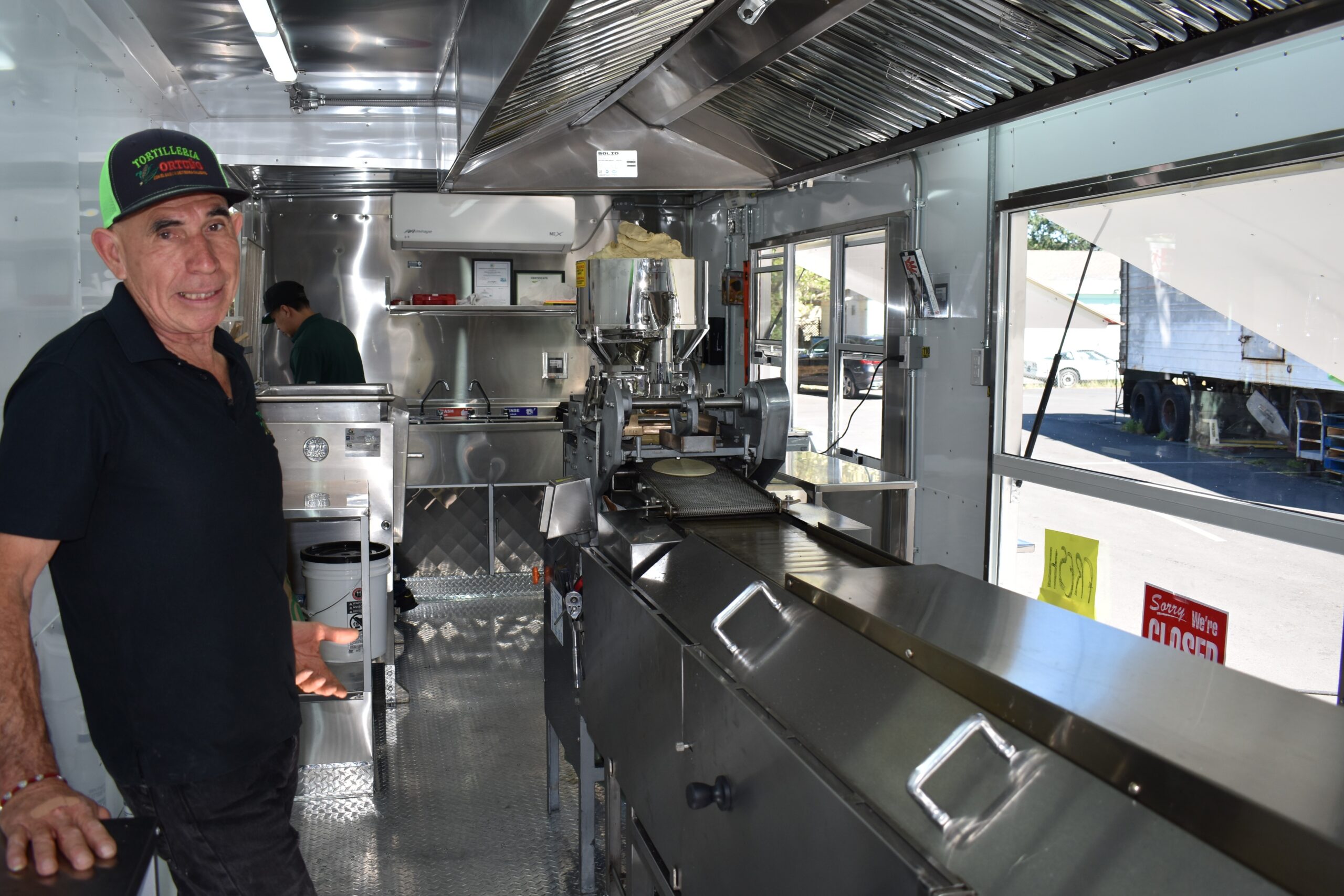 Ramiro Ortuño shows the machinery inside his mobile tortilla factory "Tortilleria Ortuño," a food truck parked behind Sonoma Valley Fruit Basket at 18474 Sonoma Highway. Friday, April 3, 2026, in Sonoma. (Raquel Issenberg/La Prensa Sonoma)