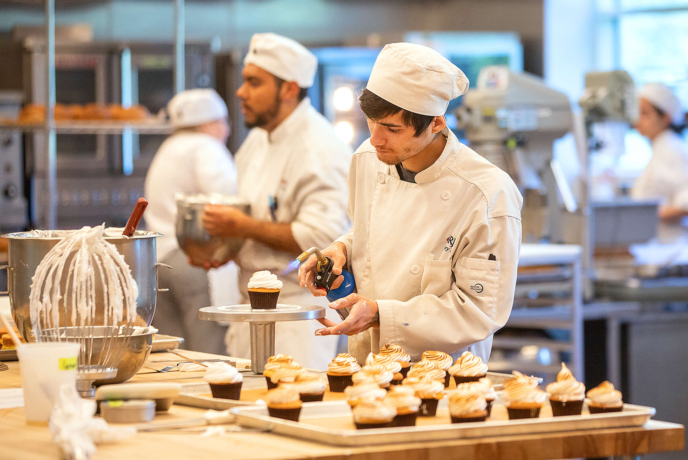 Santa Rosa Junior College culinary program students put their lessons to the test during lunch service at the Café Rose April 20, 2023. (John Burgess/The Press Democrat)