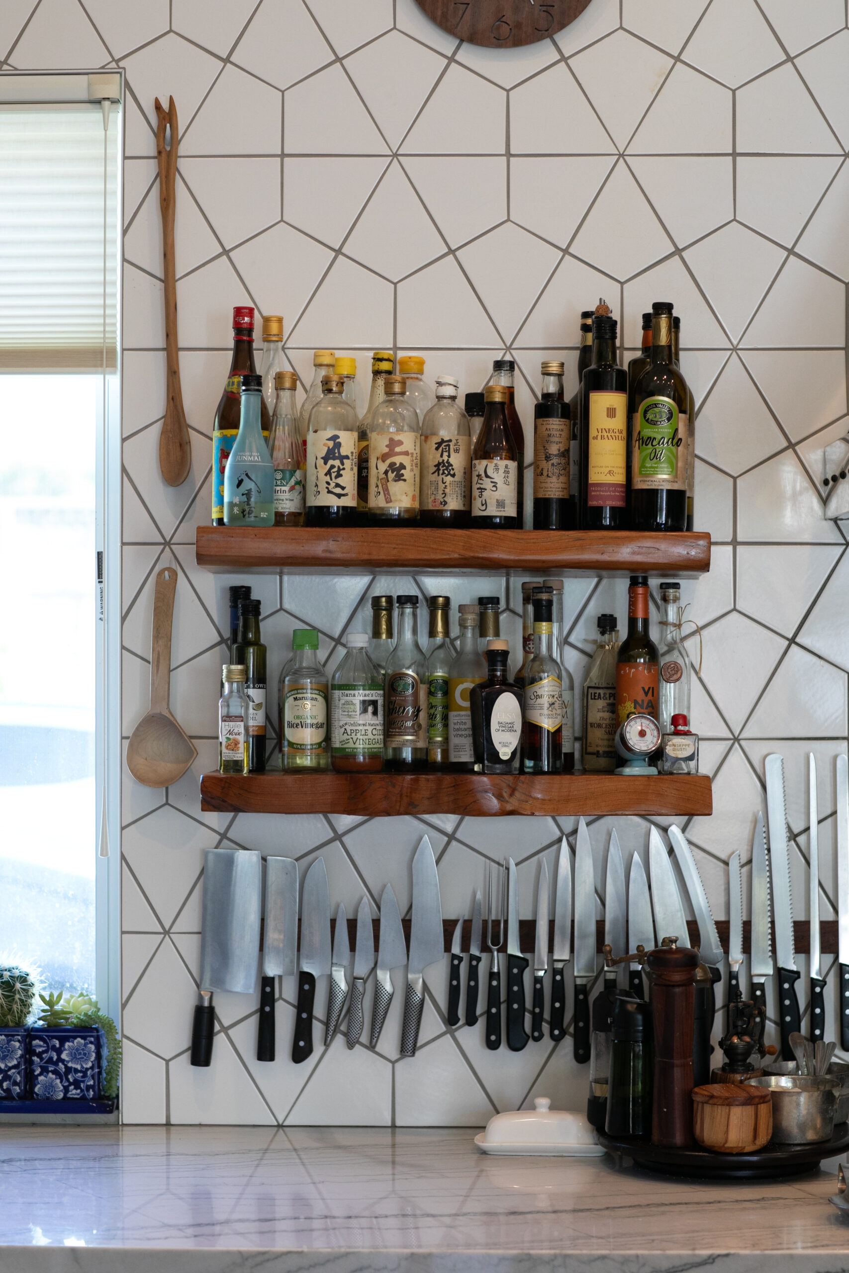 A selection of vinegars and oils are always within easy reach in the indoor kitchen. (Eileen Roche)