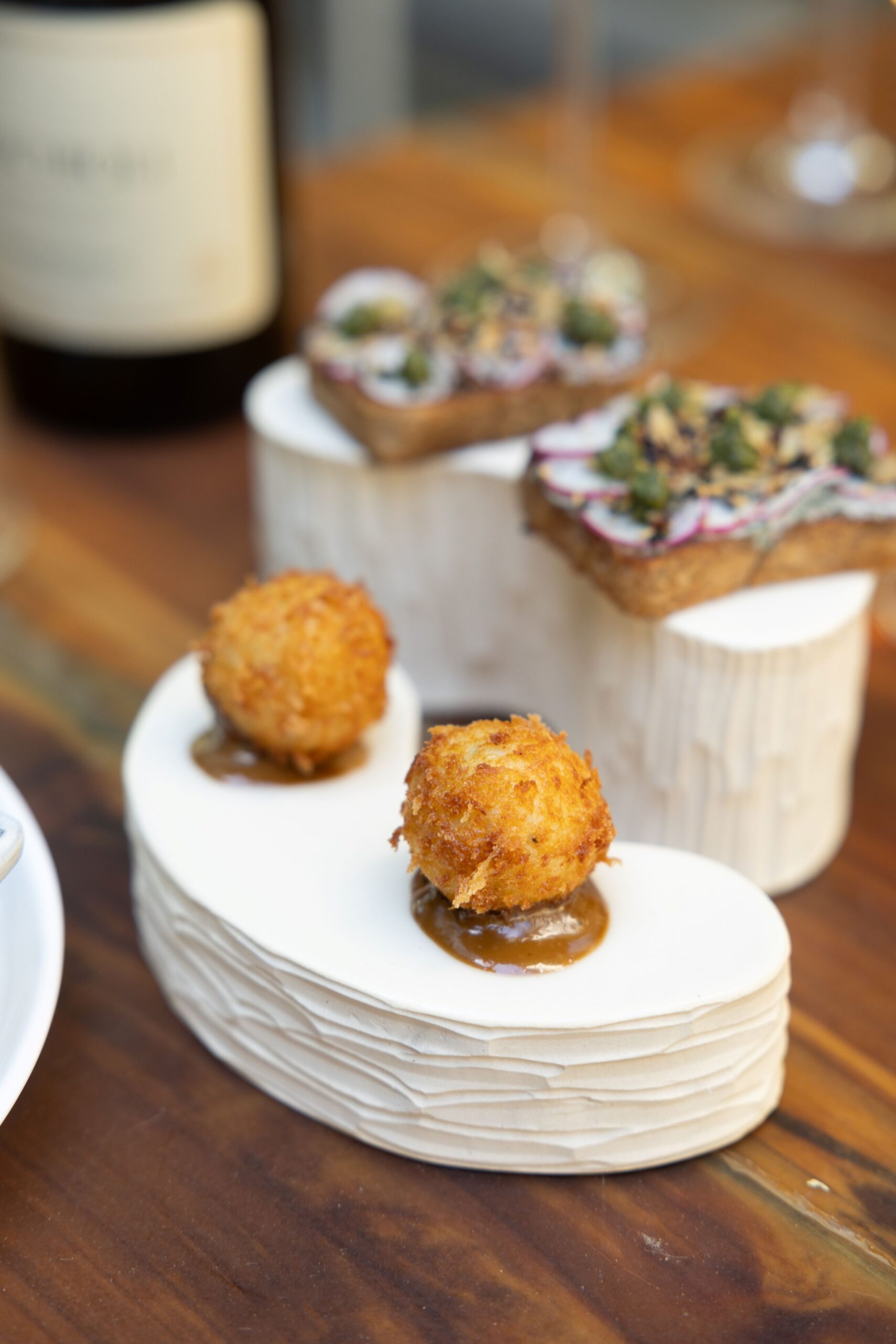Healdsburg's Dry Creek Kitchen uses Jee Park-designed ceramic canapé couches for its dinner service. 