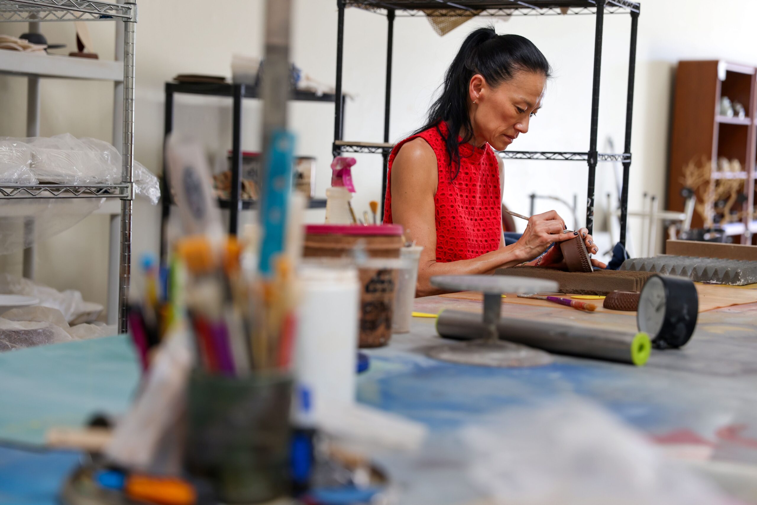 Jee Park, of Seoul Sister Studio, works on etching a clay bowl at her studio in Healdsburg